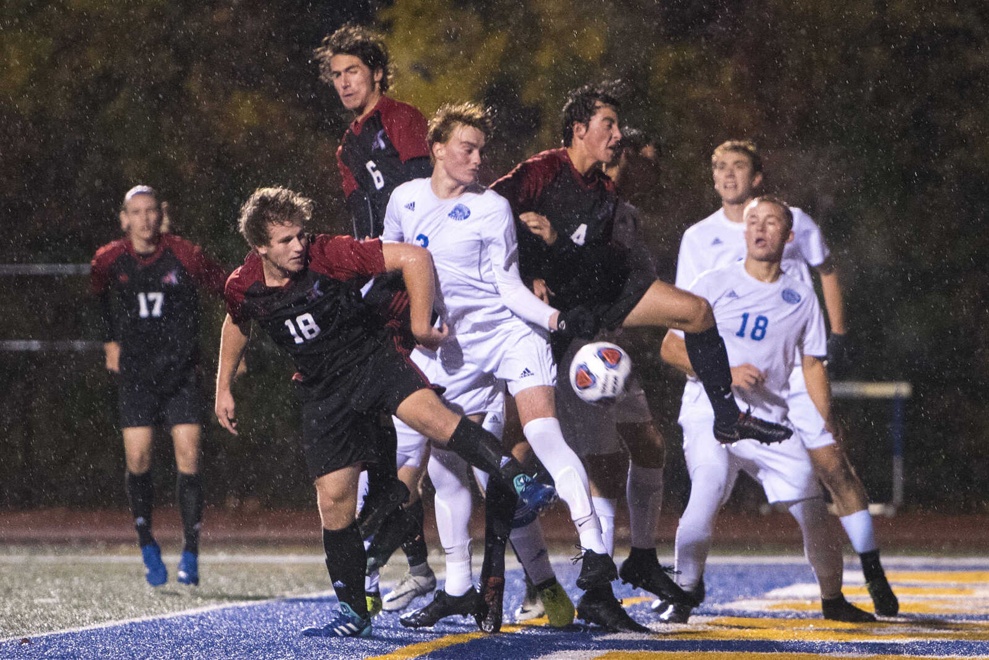 Players from Jackson and Northwest collide as a corner kick falls Northwest's goal box during the Class 4 District 1 boys soccer championship game Thursday, Nov. 1, 2018, in Imperial, Missouri.