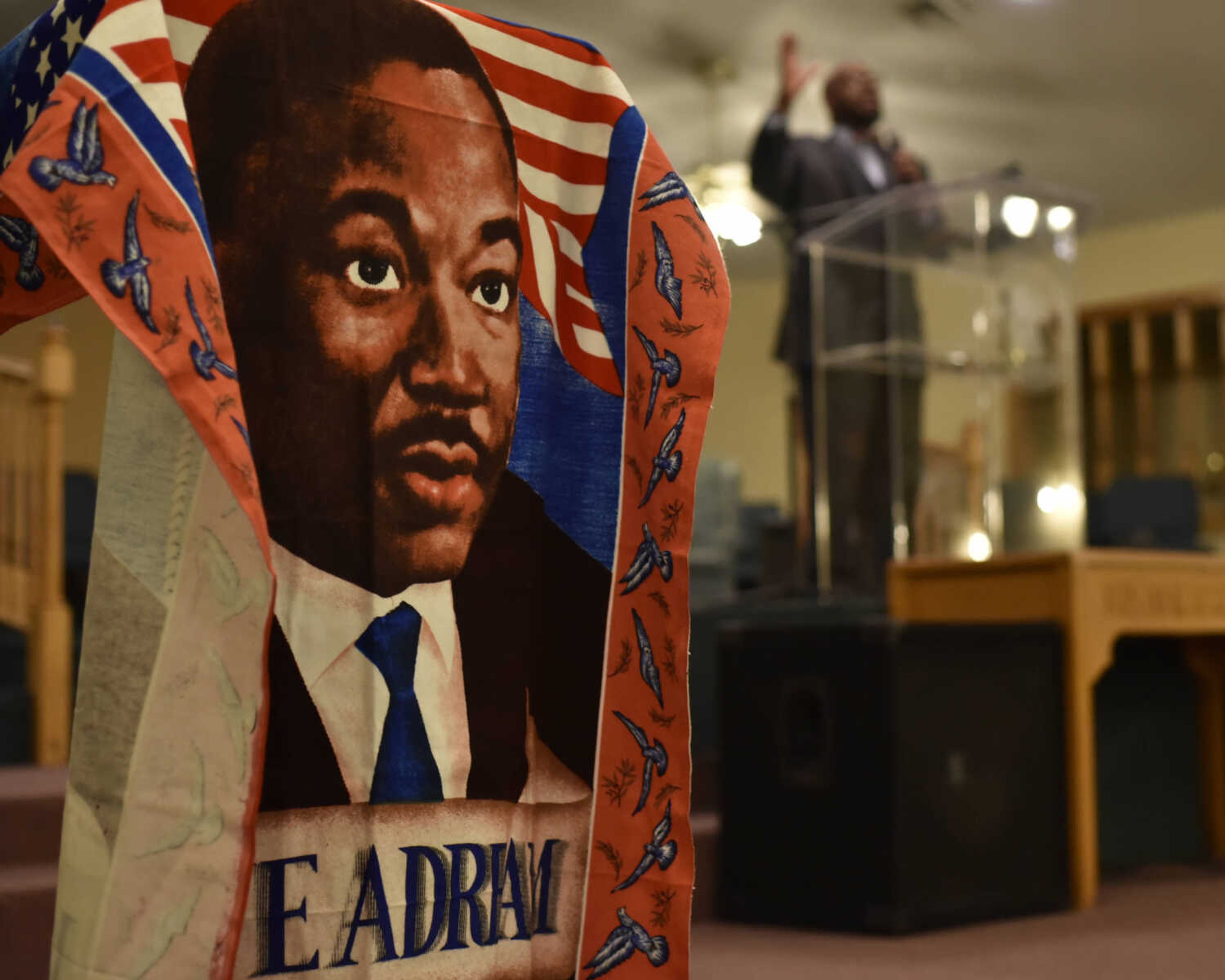 BEN MATTHEWS ~ bmatthews@semissourian.com&nbsp;A banner depicting Dr. Martin Luther King, Jr. hangs from the podium at Greater Dimension Church during Pastor Christopher E. Swims's keynote address at the 27th Annual Dr. Martin Luther King, Jr. Community Celebration Program on January 15, 2017.