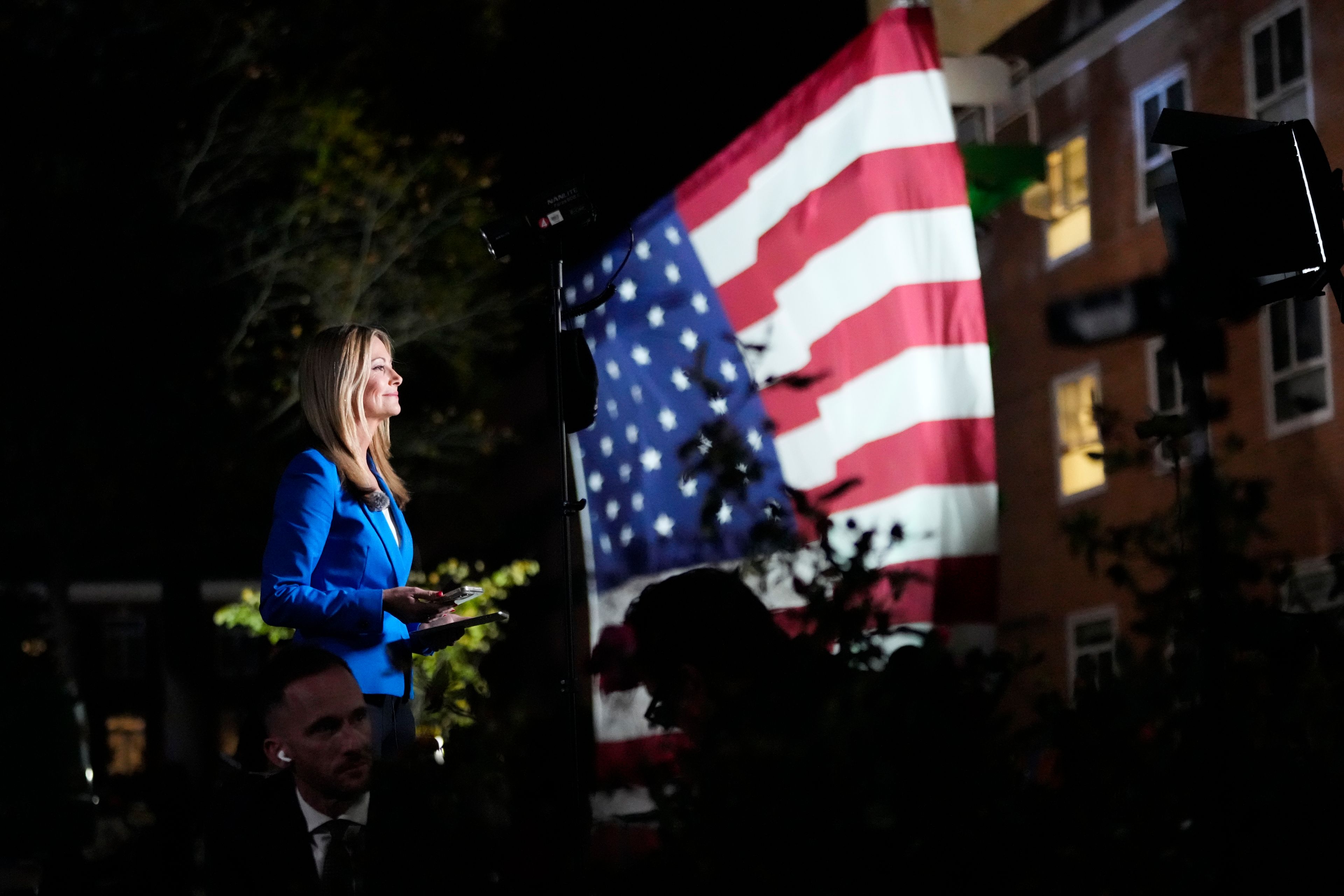 Members of the media work ahead of an election night campaign watch party for Democratic presidential nominee Vice President Kamala Harris, Tuesday, Nov. 5, 2024, on the campus of Howard University in Washington. (AP Photo/Ben Curtis)