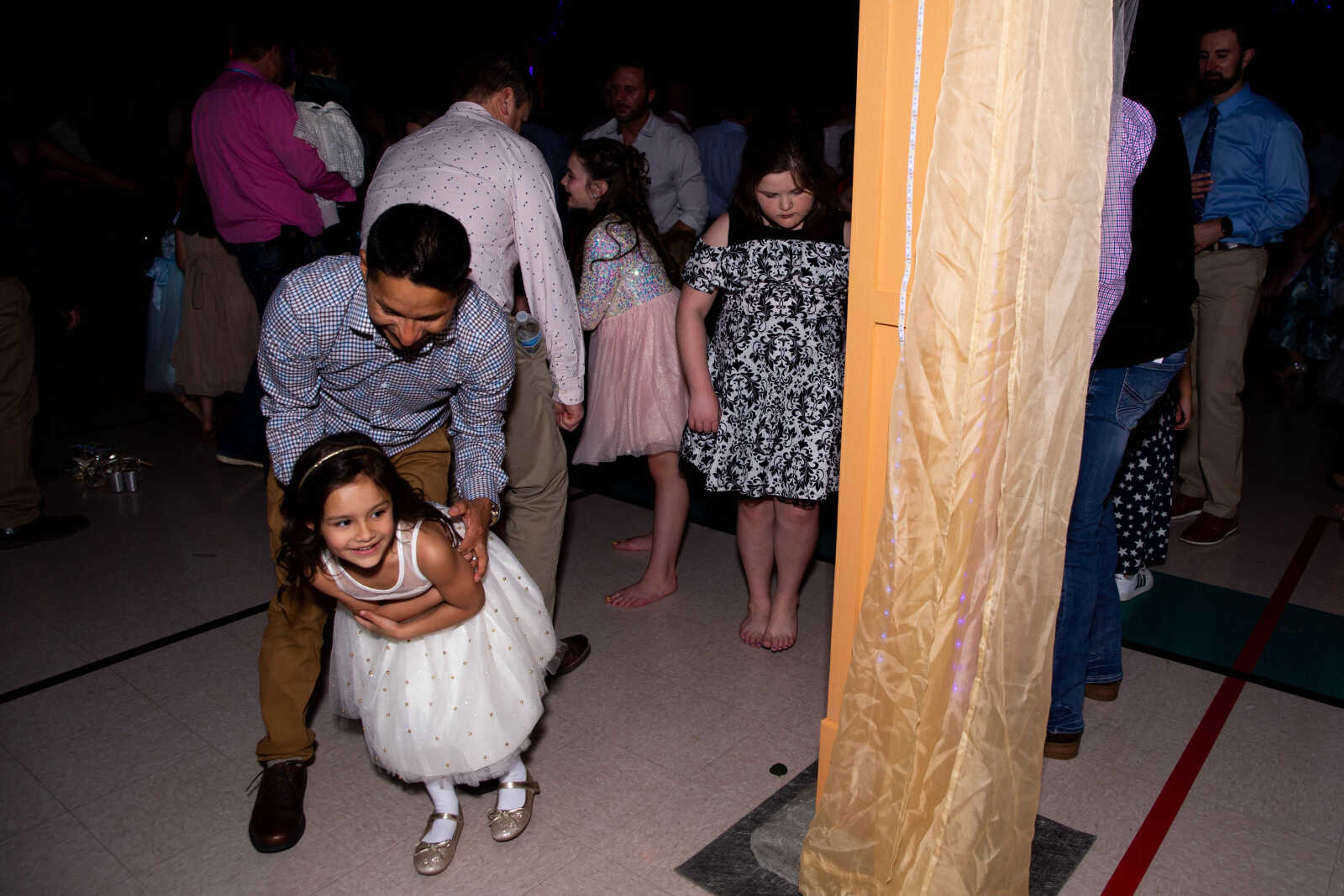 Ed Heath and daughter Millie Heath, 5, dance together.