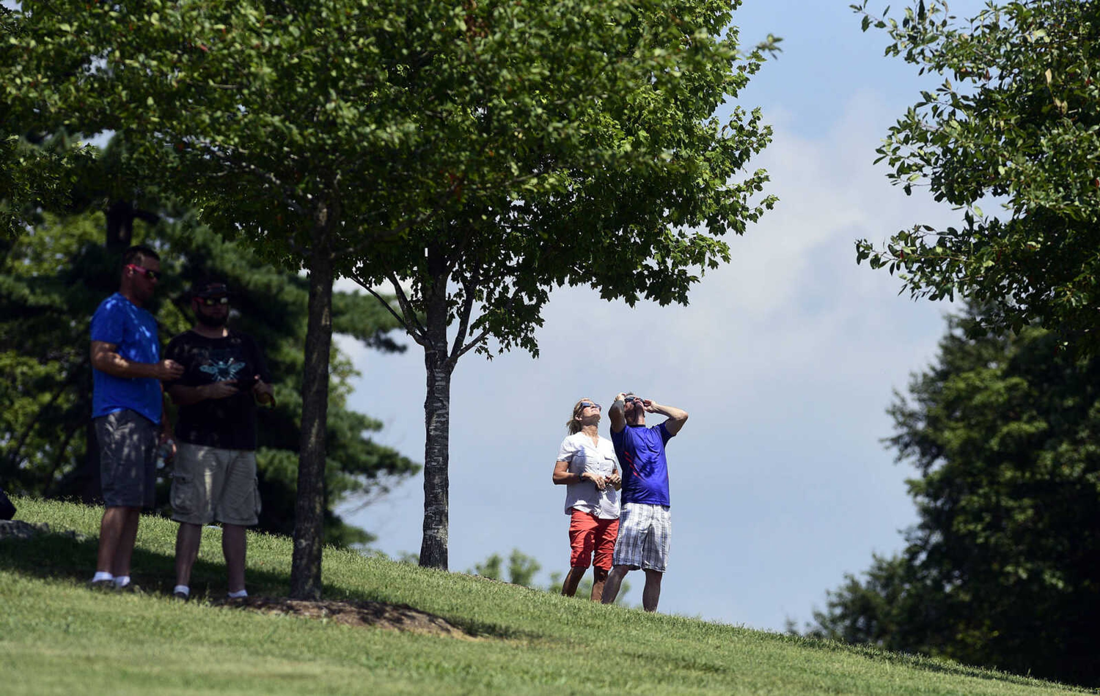 Visitors watch the stages of the solar eclipse on Monday, Aug. 21, 2017, from the River Campus in Cape Girardeau.