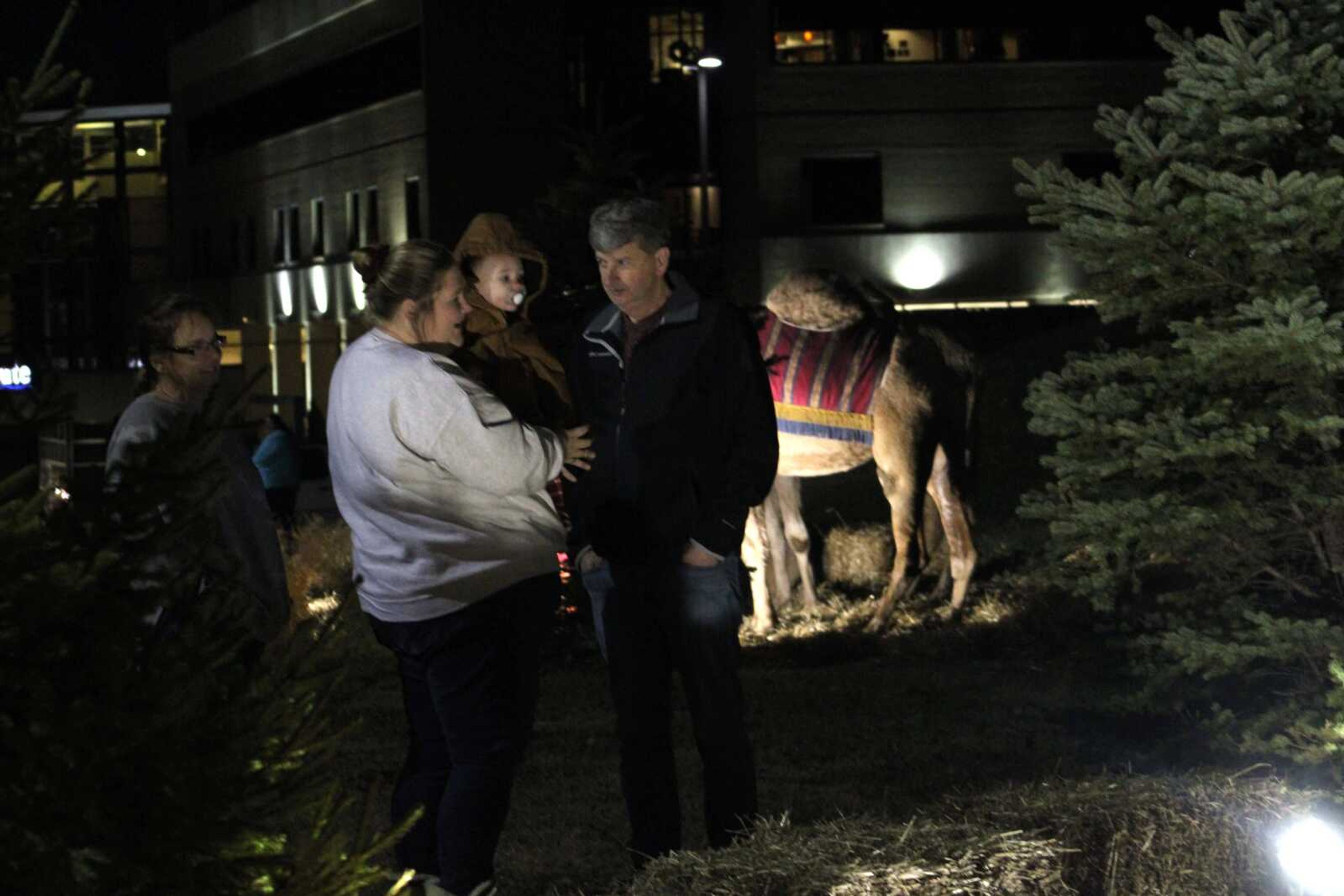 Attendees gather to look at the Live Nativity Scene created by Saint Francis Healthcare System in Cape Girardeau Saturday, Dec. 18, 2021.