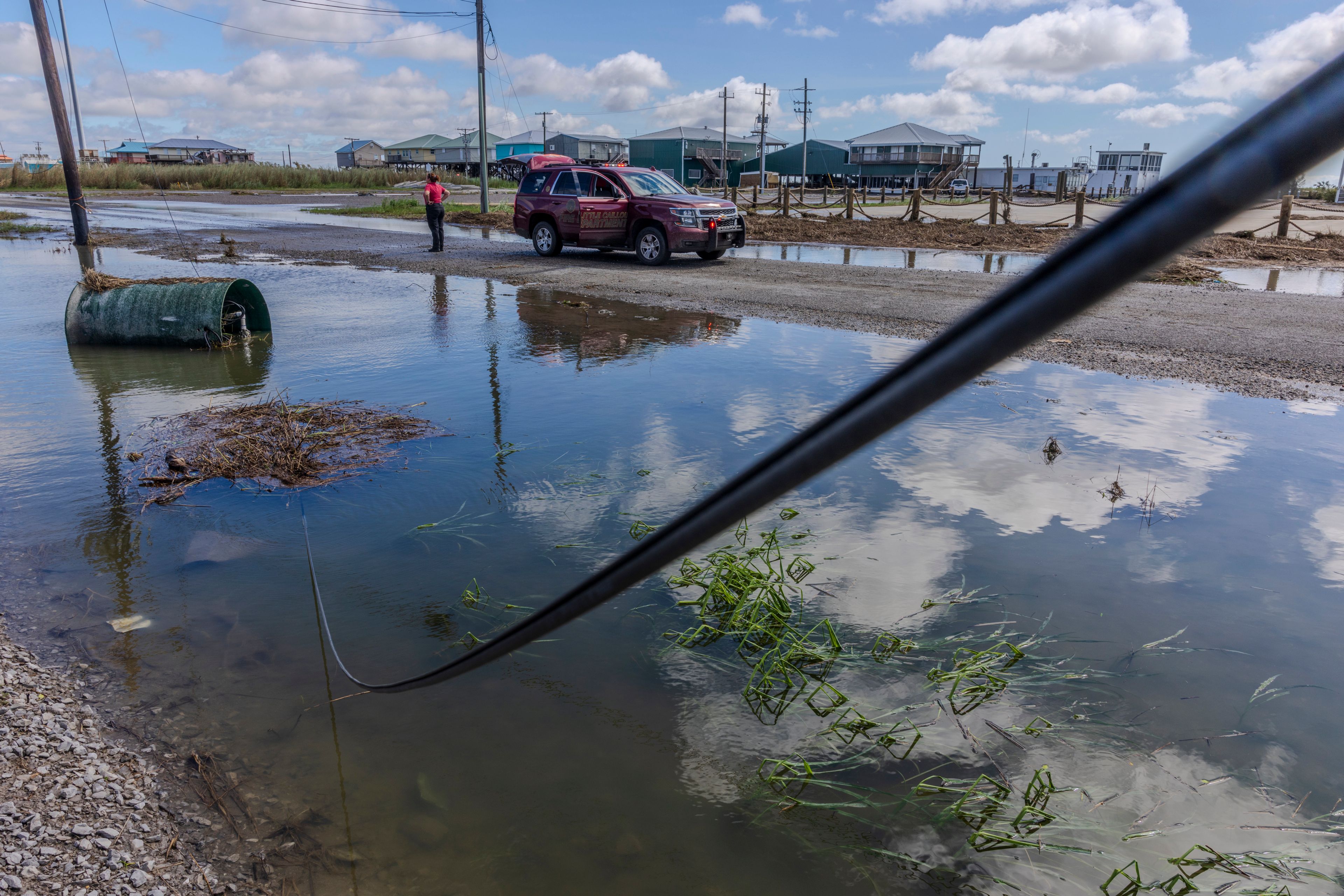 Little Caillou Fire Department staff survey the damage from Hurricane Francine at the end of Highway 57 in the southern most point of Terrebonne Parish, La., Thursday, Sept. 12, 2024. (Chris Granger/The Times-Picayune/The New Orleans Advocate via AP)