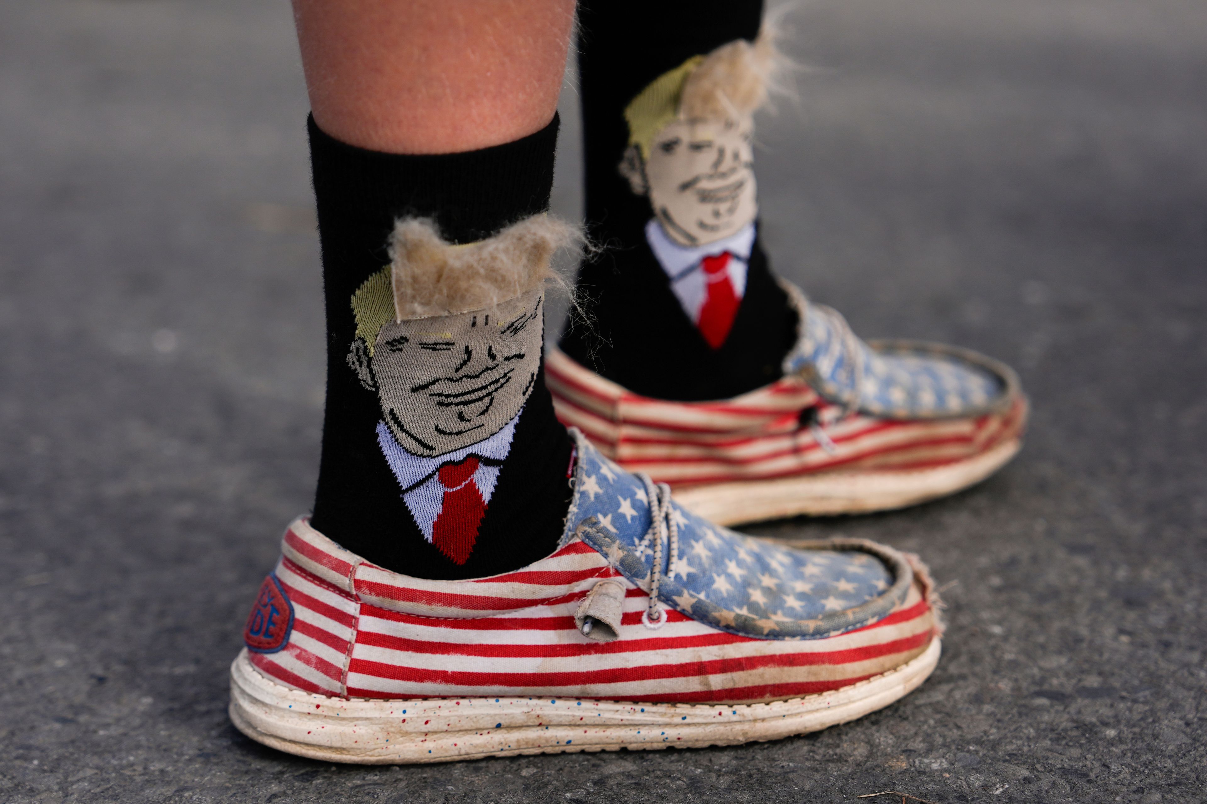 An person wears Donald Trump-themed socks before a campaign rally for Republican presidential nominee former President Donald Trump at Riverfront Sports, Wednesday, Oct. 9, 2024, in Scranton, Pa. (AP Photo/Julia Demaree Nikhinson)