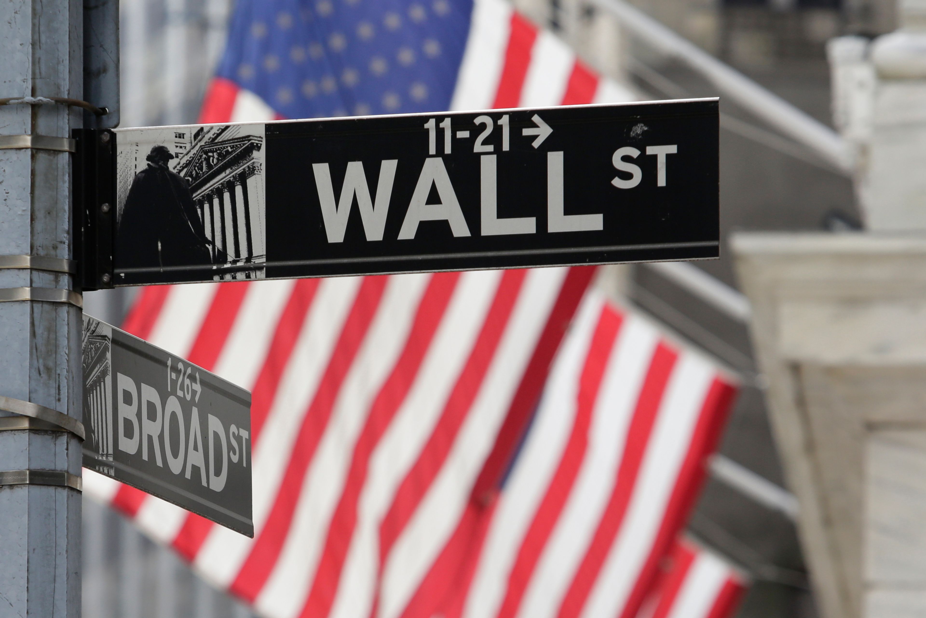 FILE - Signs marking the intersection of Broad and Walls Streets appear near the New York Stock Exchange on Oct. 1, 2024, in New York. (AP Photo/Peter Morgan, File)