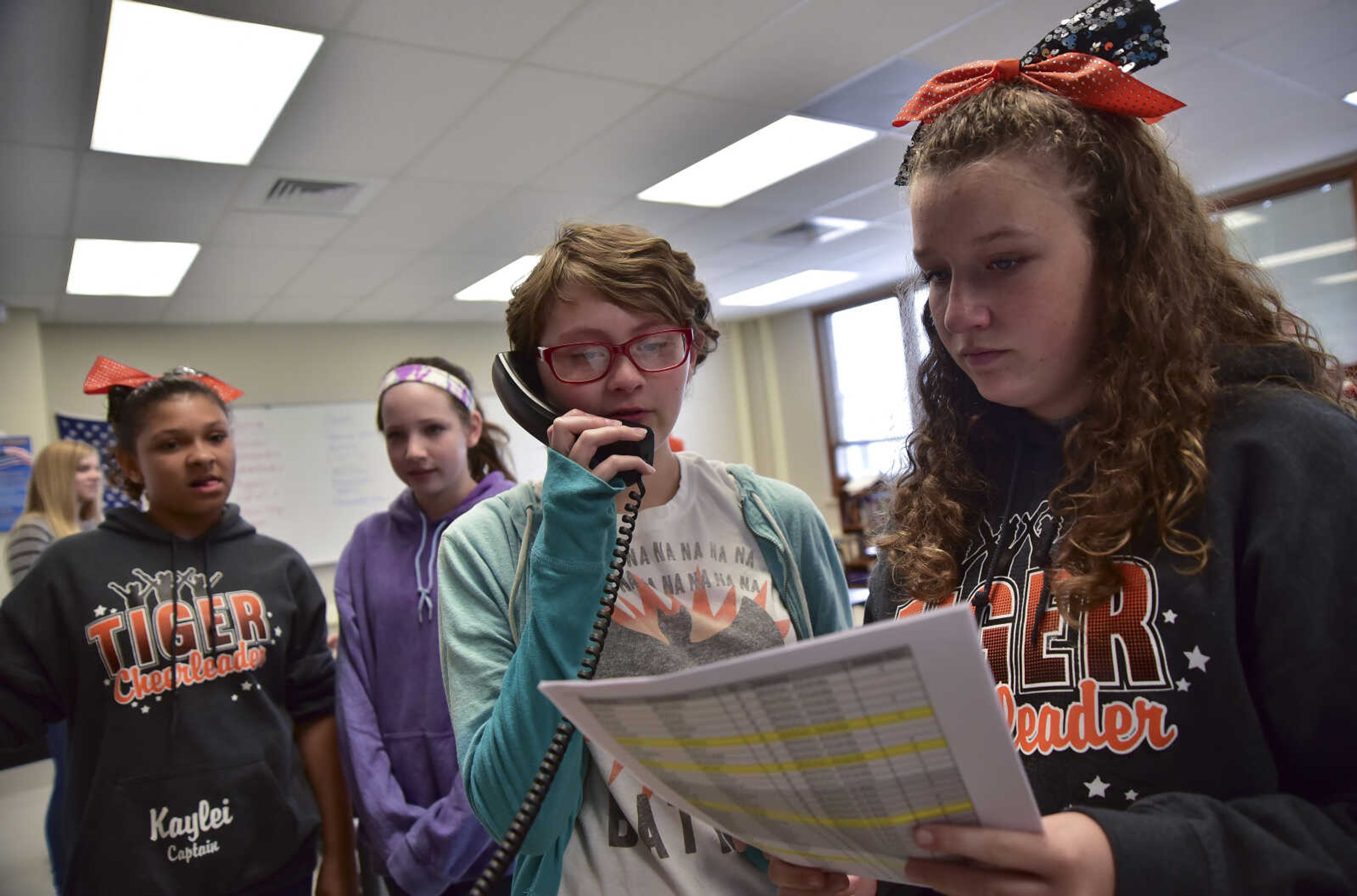 ANDREW J. WHITAKER ~ awhitaker@semissourian.comLorelai Club, left, and Evie Frazier, right read off the election results over the intercom during a mock election Tuesday, Nov. 8, 2016 at Cape Central Junior High School in Cape Girardeau.