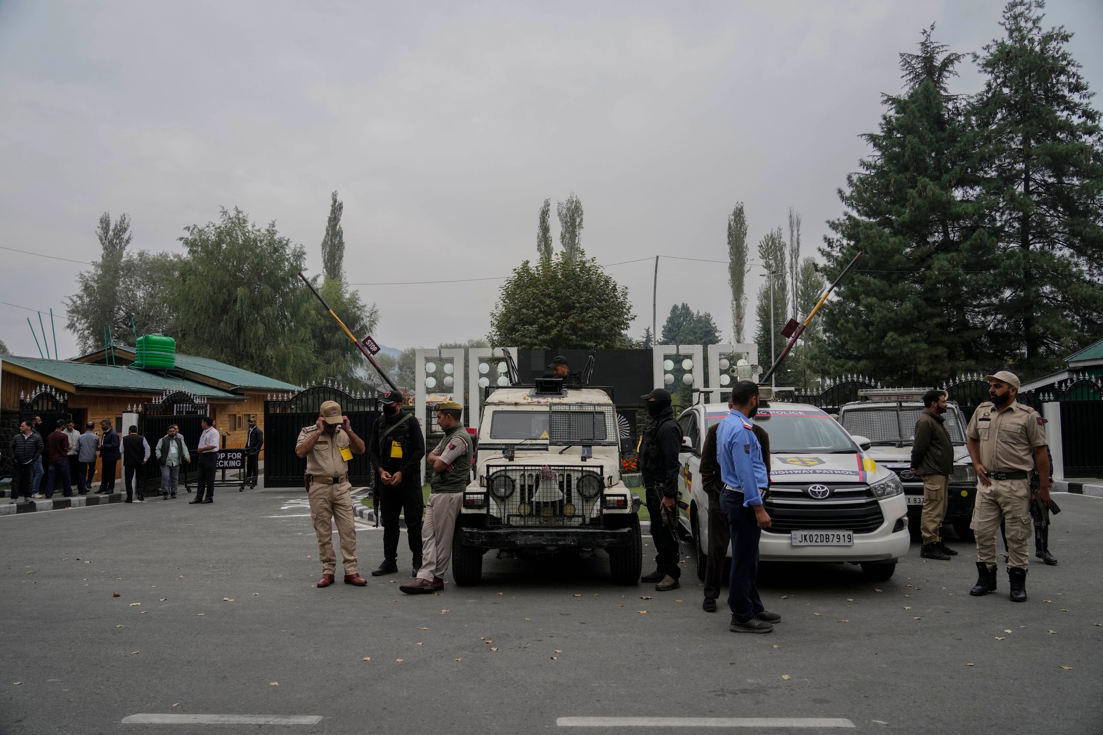 Indian police guard outside a vote counting center for the recent election on the outskirts of Srinagar, Indian controlled Kashmir, Tuesday, Oct. 8, 2024. (AP Photo/Mukhtar Khan)