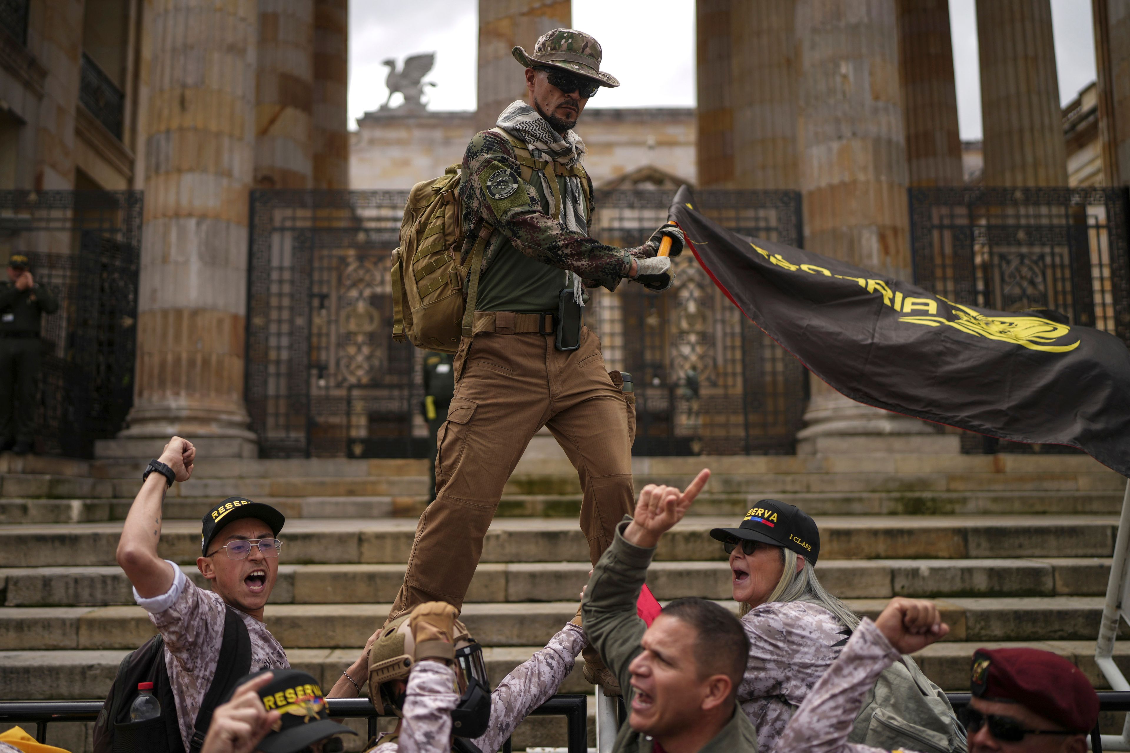 Demonstrators march against the government of President Gustavo Petro, in Bogotá, Colombia, Nov. 23, 2024. (AP Photo/Ivan Valencia)