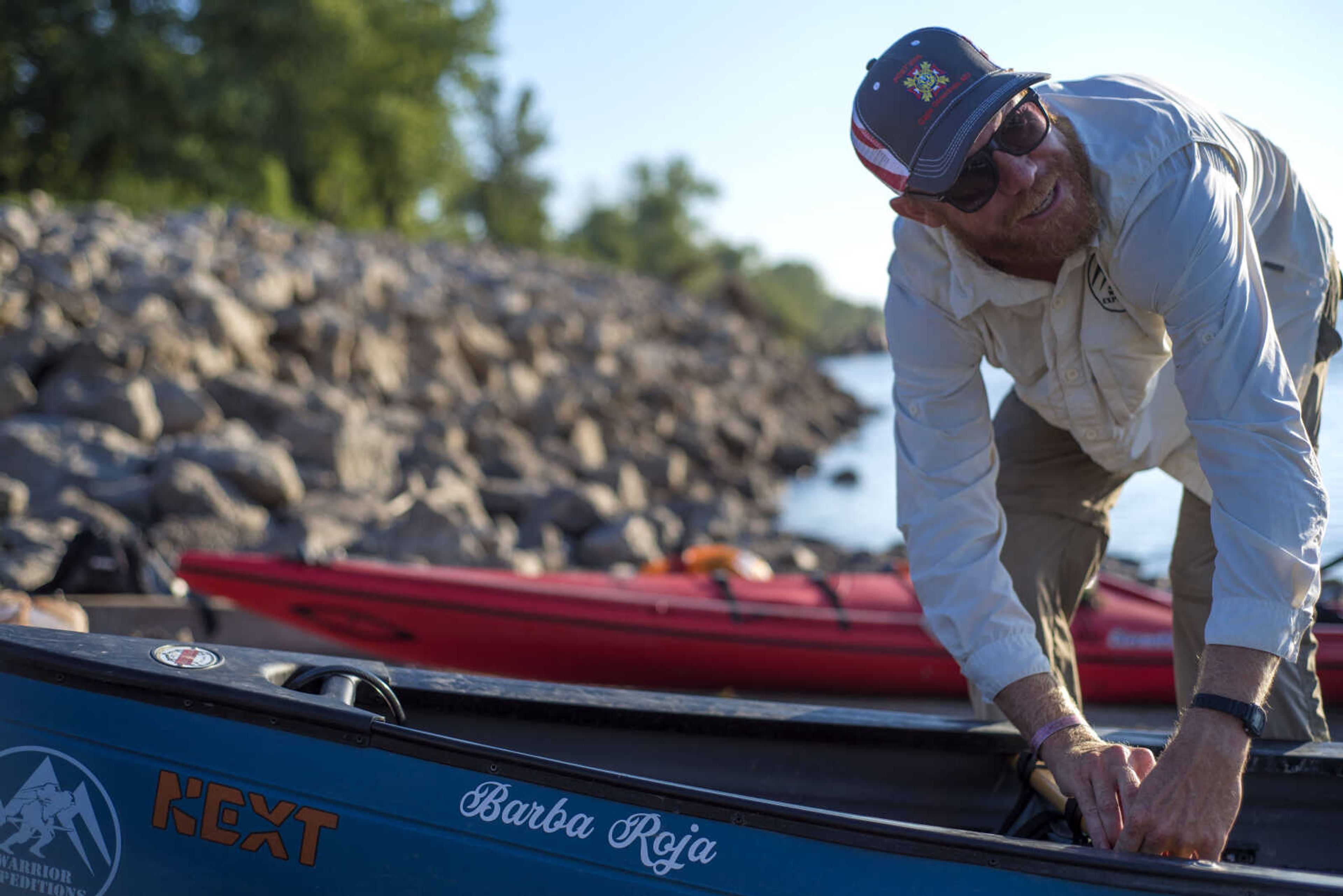 Army veteran Matt Roy packs his kayak before pushing off into the Mississippi River at the Red Star dock in Cape Girardeau Tuesday morning. 
The inscription on Roy's kayak, "Barba Roja," is Spanish for "red beard."