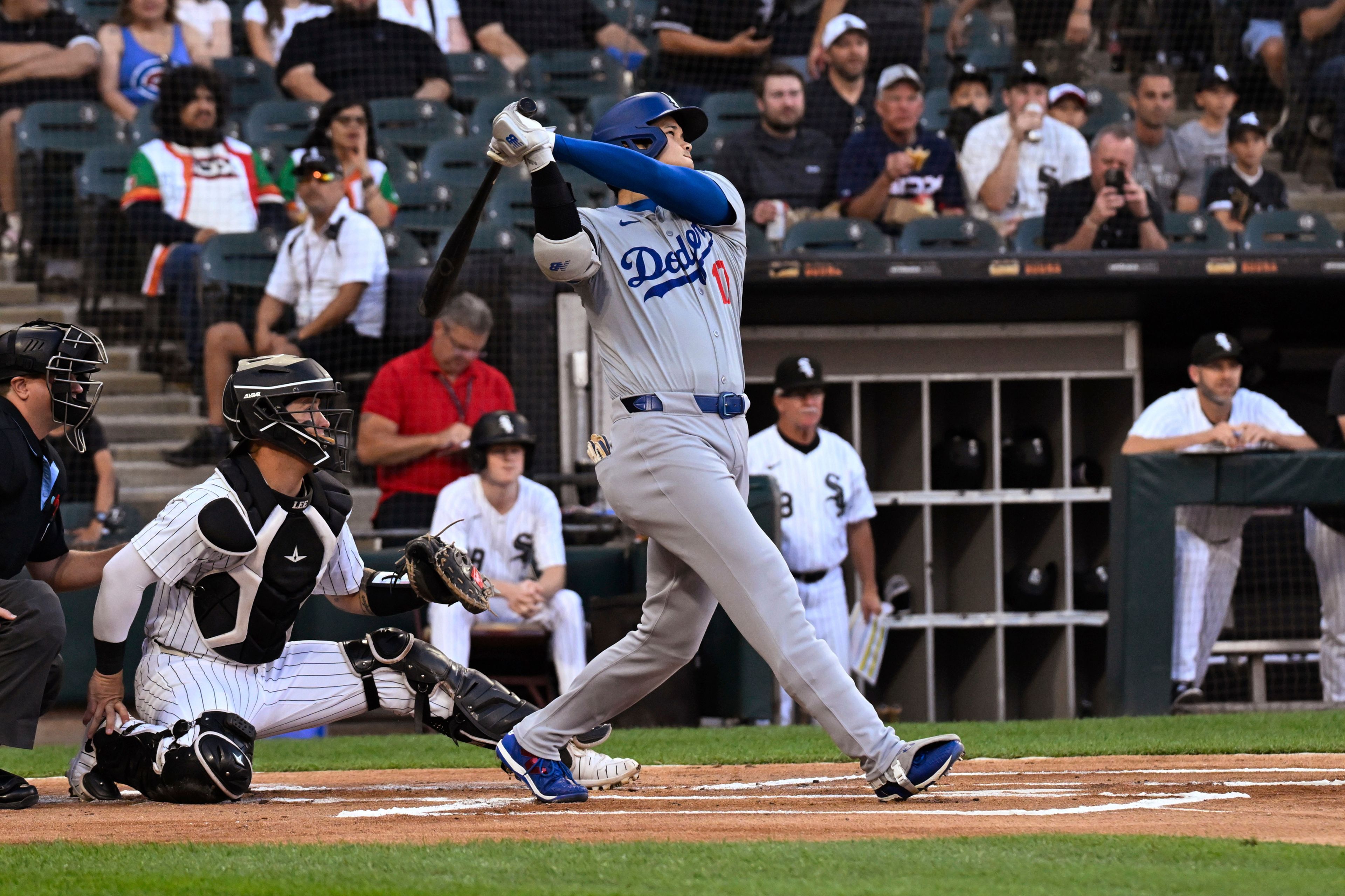 Los Angeles Dodgers designated hitter Shohei Ohtani watches his home run against the Chicago White Sox during the first inning of a baseball game aWednesday, June 26, 2024, in Chicago. (AP Photo/Matt Marton)