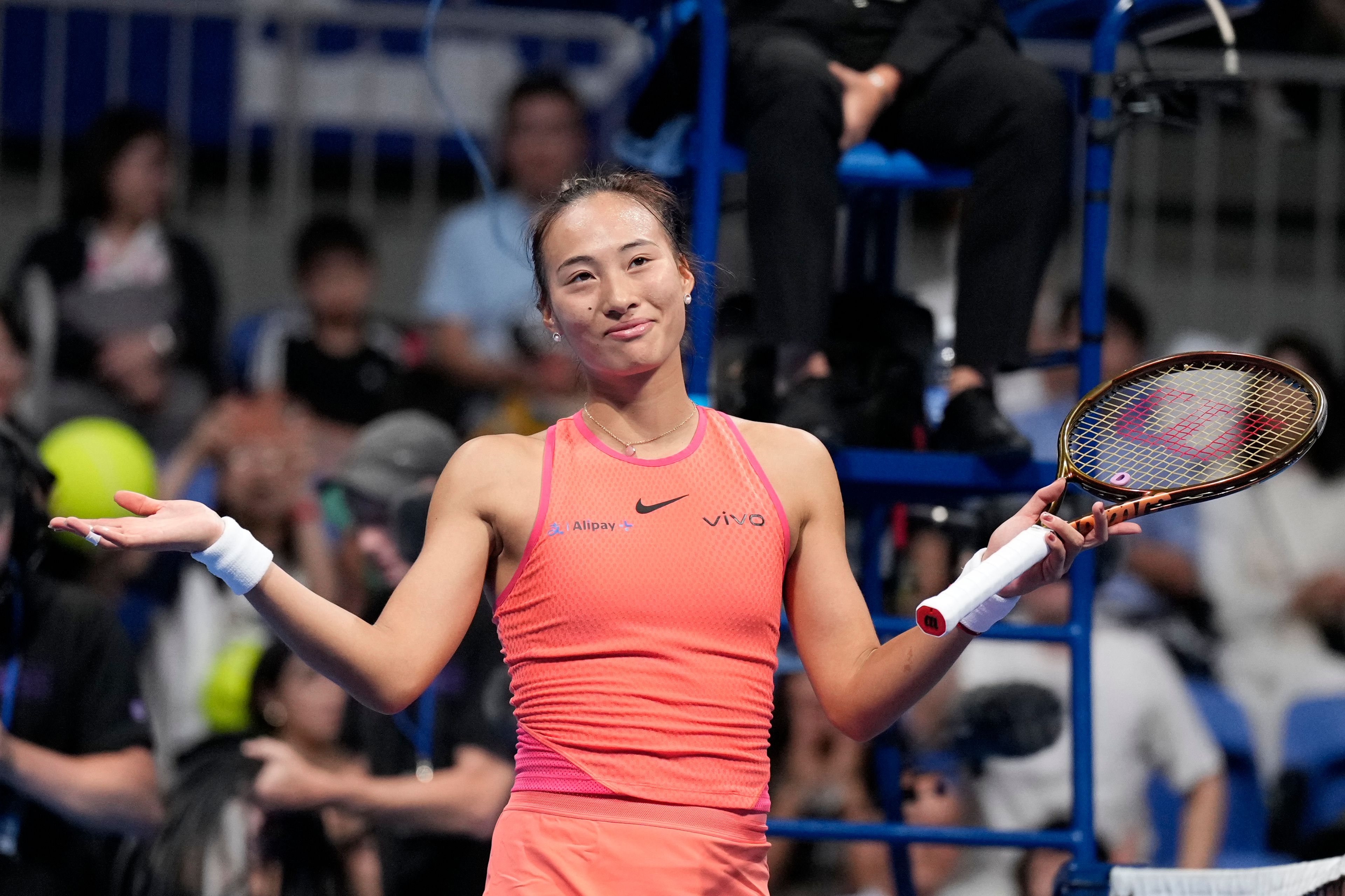 China's Zheng Qinwen gestures after winning against Sofia Kenin of the United States in the final match of the Pan Pacific Open women's tennis tournament at Ariake Coliseum, in Tokyo, Sunday, Oct. 27, 2024. (AP Photo/Eugene Hoshiko)