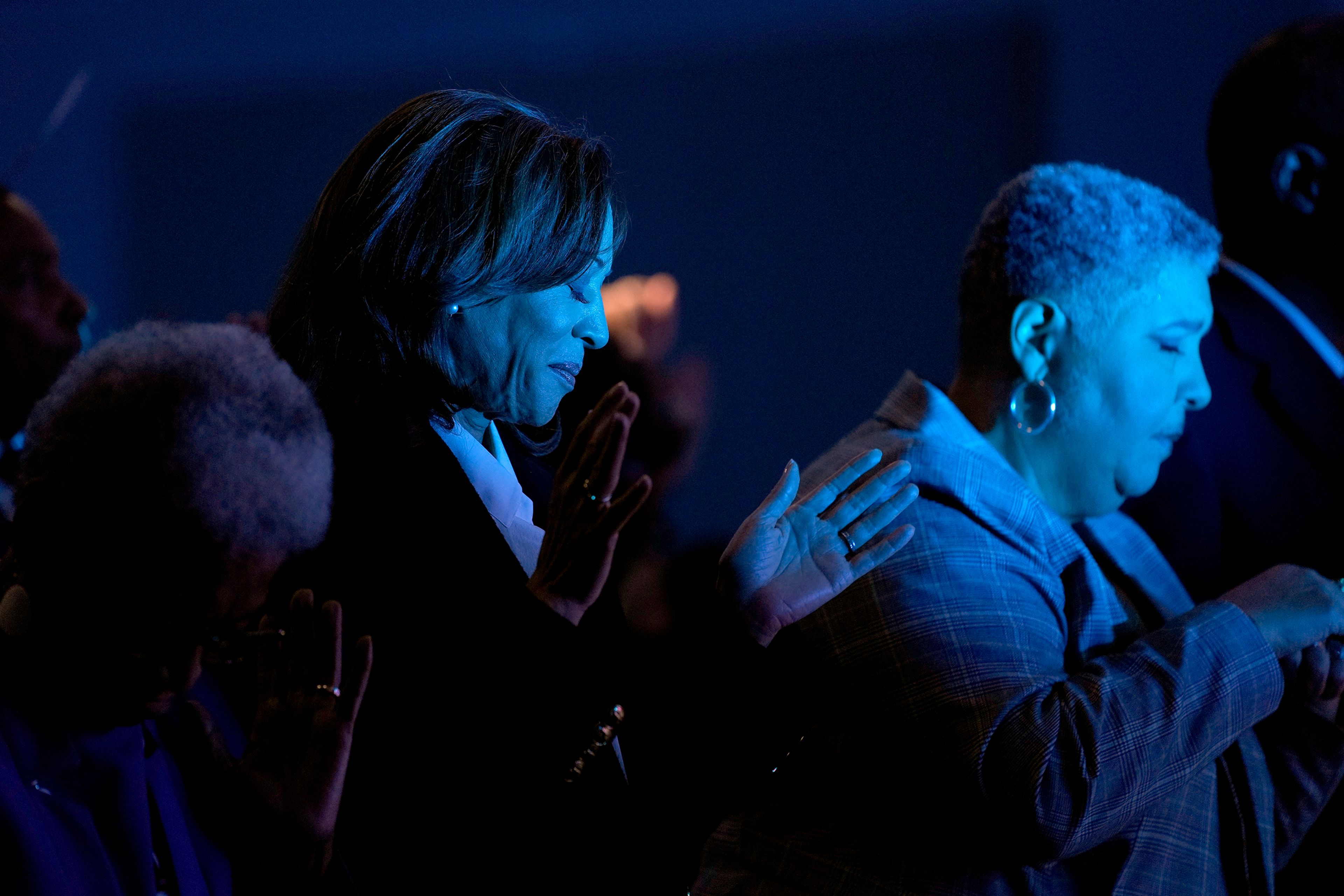 Democratic presidential nominee Vice President Kamala Harris, left, prays alongside bishop Rosie O'neal during a church service at Koinonia Christian Center in Greenville, N.C., Sunday, Oct. 13, 2024. 