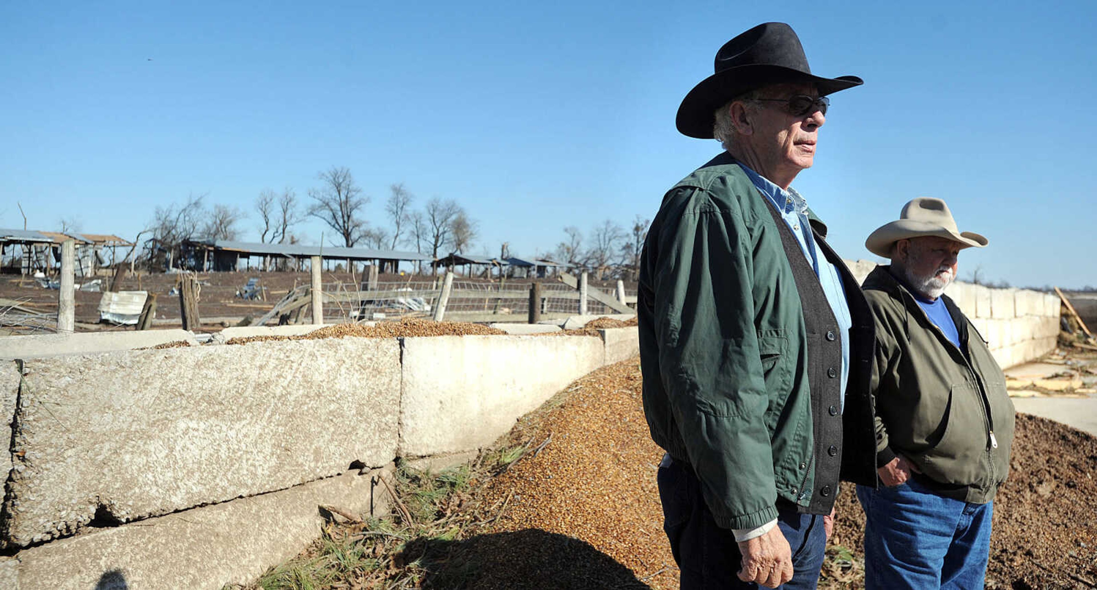 LAURA SIMON ~ lsimon@semissourian.com

Vince Draper, left, and Tote Windisch survey the damage on Draper's cattle farm, Monday, Nov. 18, 2013. Sunday's storm tore through the cattle farm, causing heavy damage and several cow fatalities.