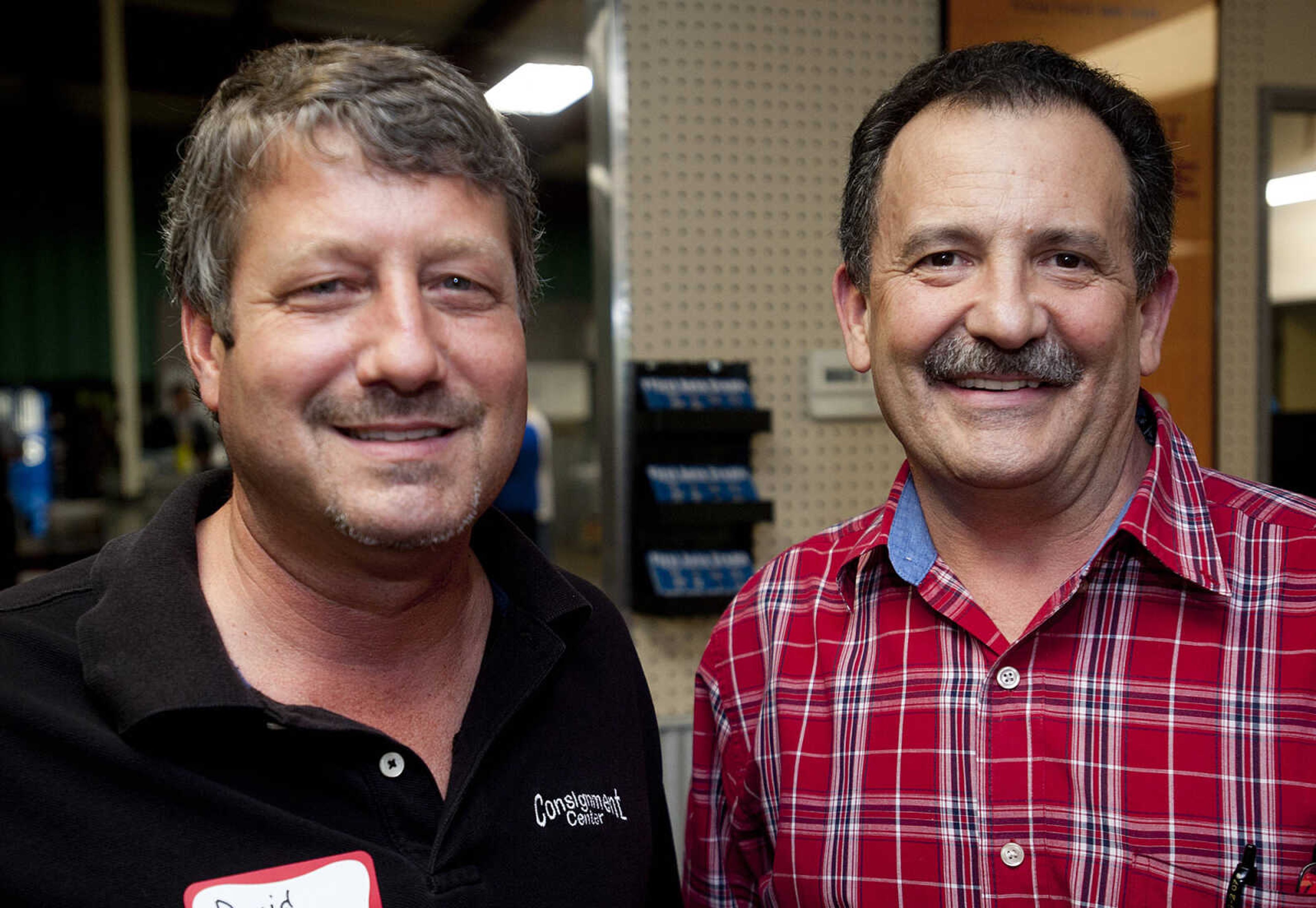 David Kinder, left, Consignment Center, and Dennis Browning, Ashley Furniture, during the Jackson Area Chamber of Commerce's After Hours event Tuesday, May 13,  at First Auto Credit in Jackson, Mo.