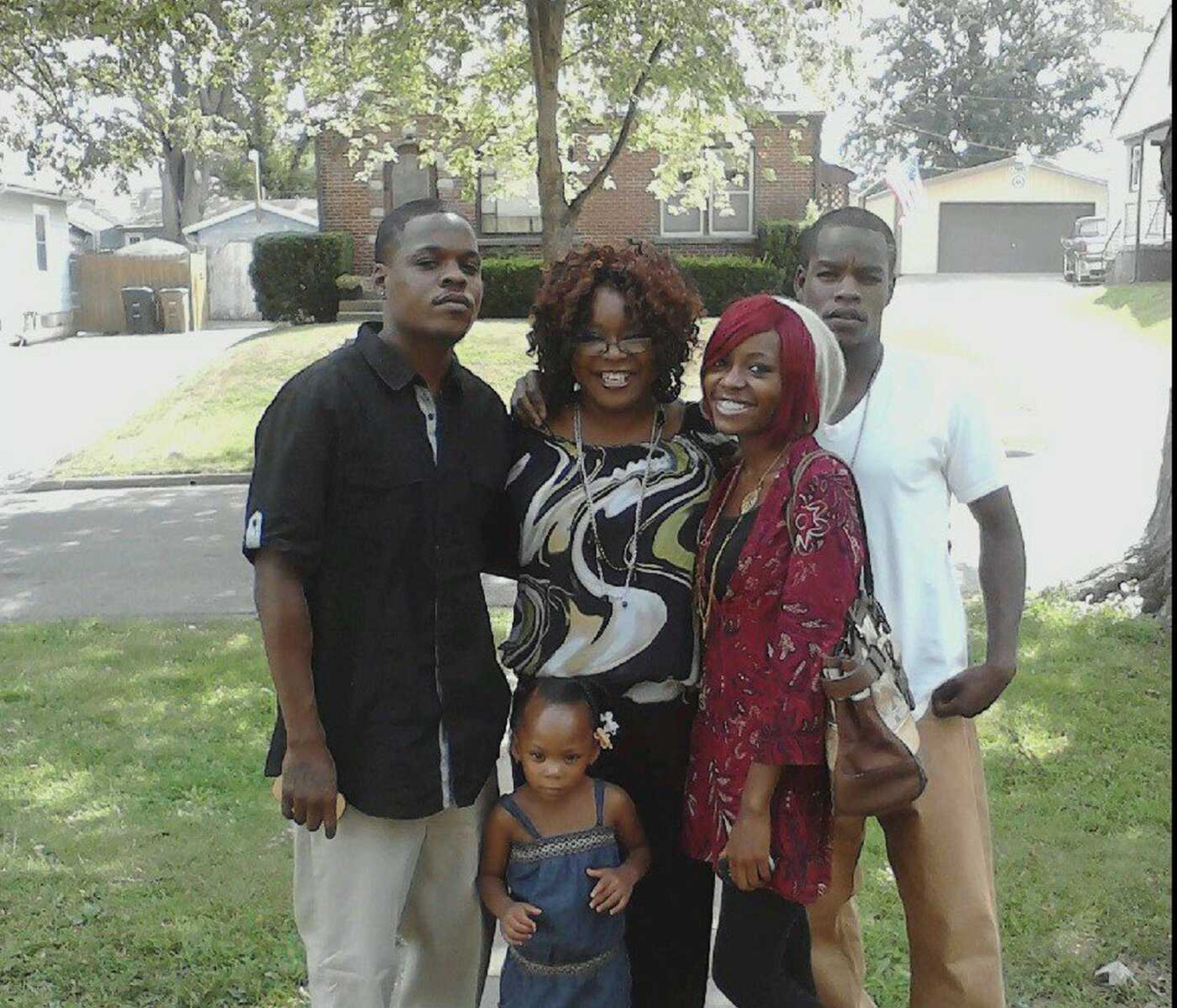 Brent Johnson, left, poses with his mother, Renee Davis; his sister Chelsea Johnson; his brother Devon Johnson; and his daughter Brilyn Sides, front row, in this undated family photo.