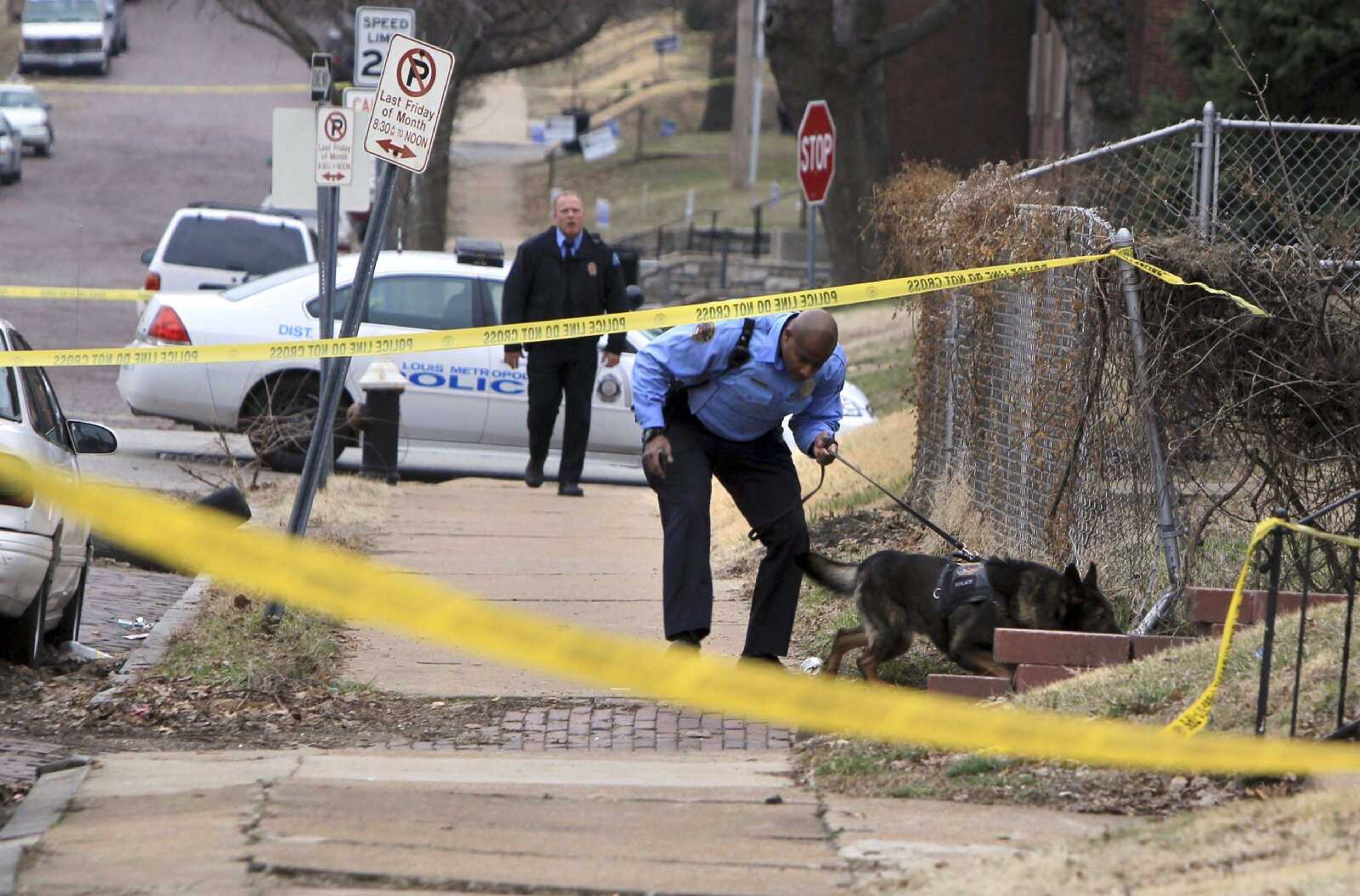 St. Louis police searched for a gunman today in St. Louis.  St. Louis police say two federal marshals and a police officer were shot during a gunfight that left another man wounded at a home. (AP Photo/St. Louis Post-Dispatch, Christian Gooden)