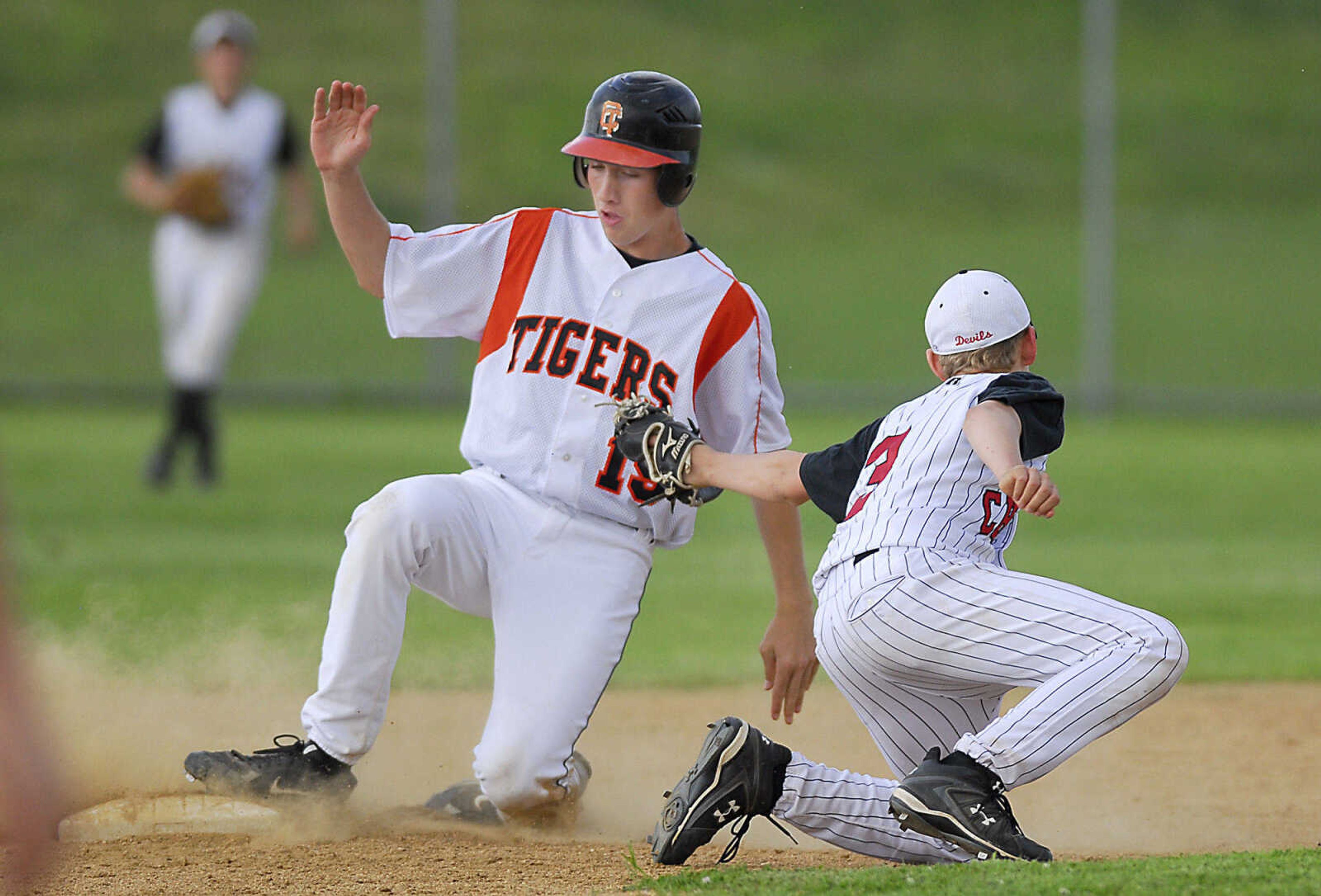 Andrew Williams safely steals second as Chaffee second baseman Alex Crowe puts on the tag Monday, May 11, 2009, at Central High in Cape Girardeau.