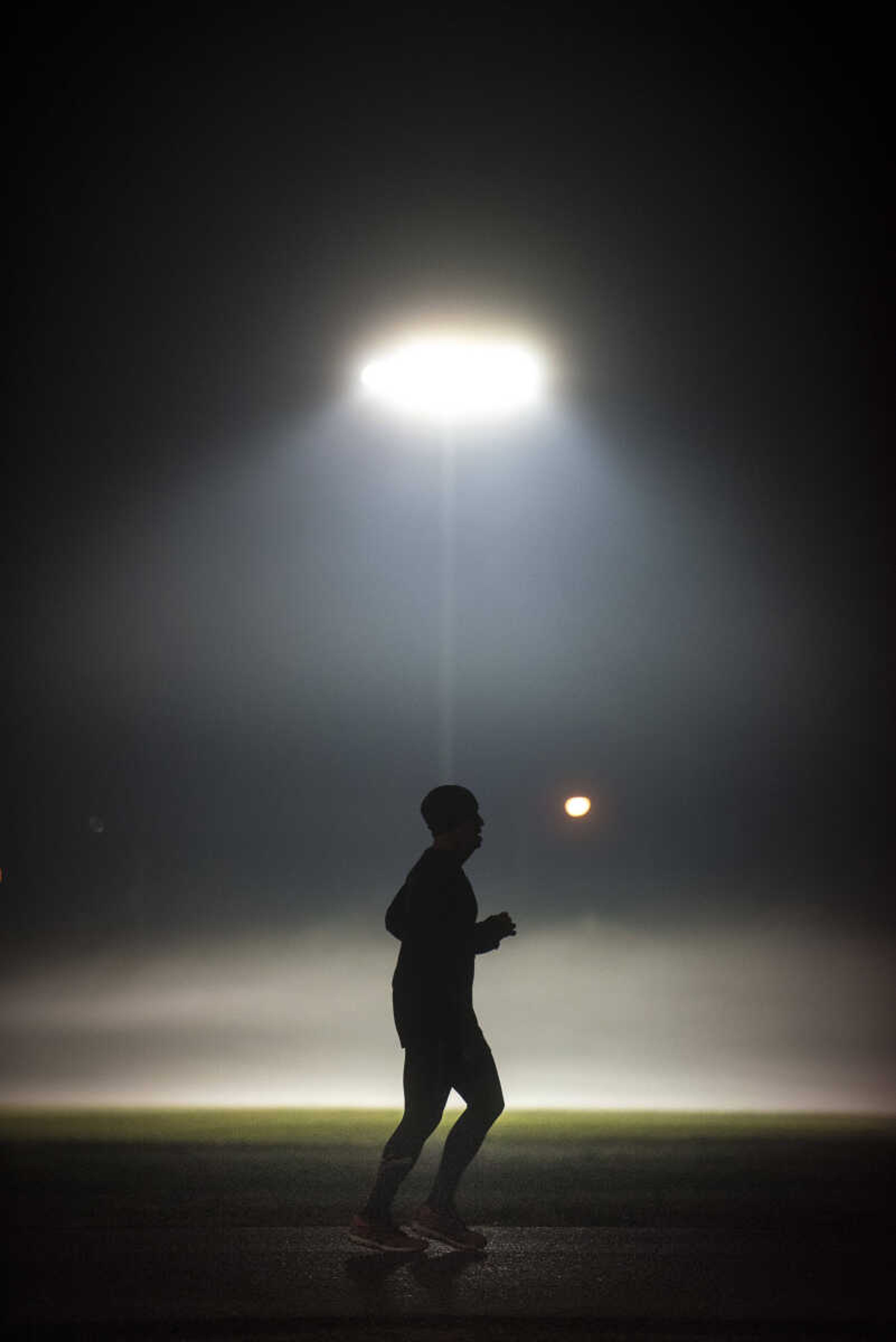 A participant makes their way around the 1-mile loop set up at Arena Park for the 8th annual Howard Aslinger Endurance Run on early Saturday morning, March 18, 2017 in Cape Girardeau. The event raises money for the Howard L. Aslinger Memorial Scholarship where runners will keep running until they can't anymore with the event starting at 7 p.m. Friday night going for 24 hours until Saturday night.