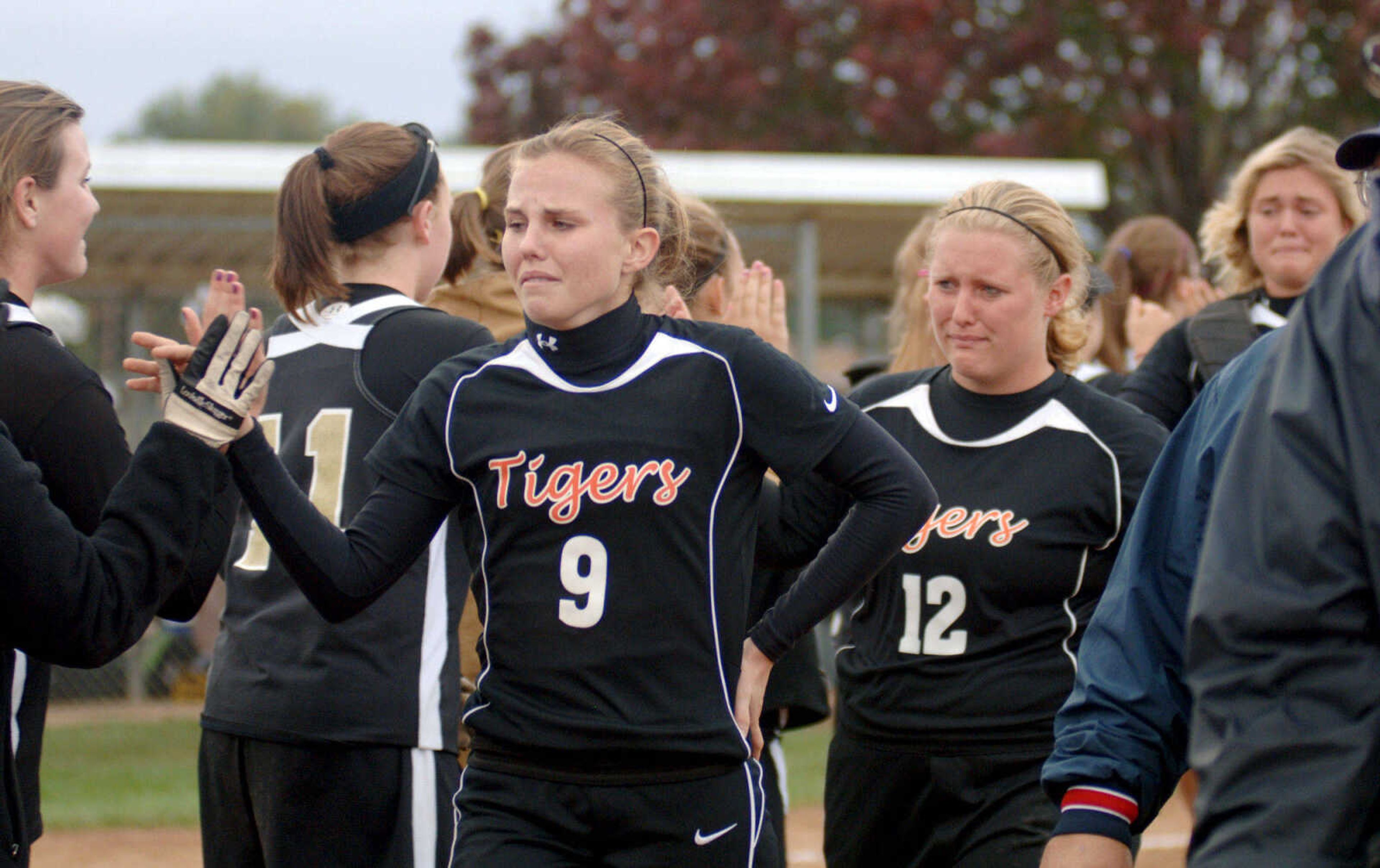 LAURA SIMON~photos@semissourian.com
The Cape Central Tigers congratulate Farmington after a long district game  Monday. The game ran 12 innings with Farmington taking the 3-2 victory.