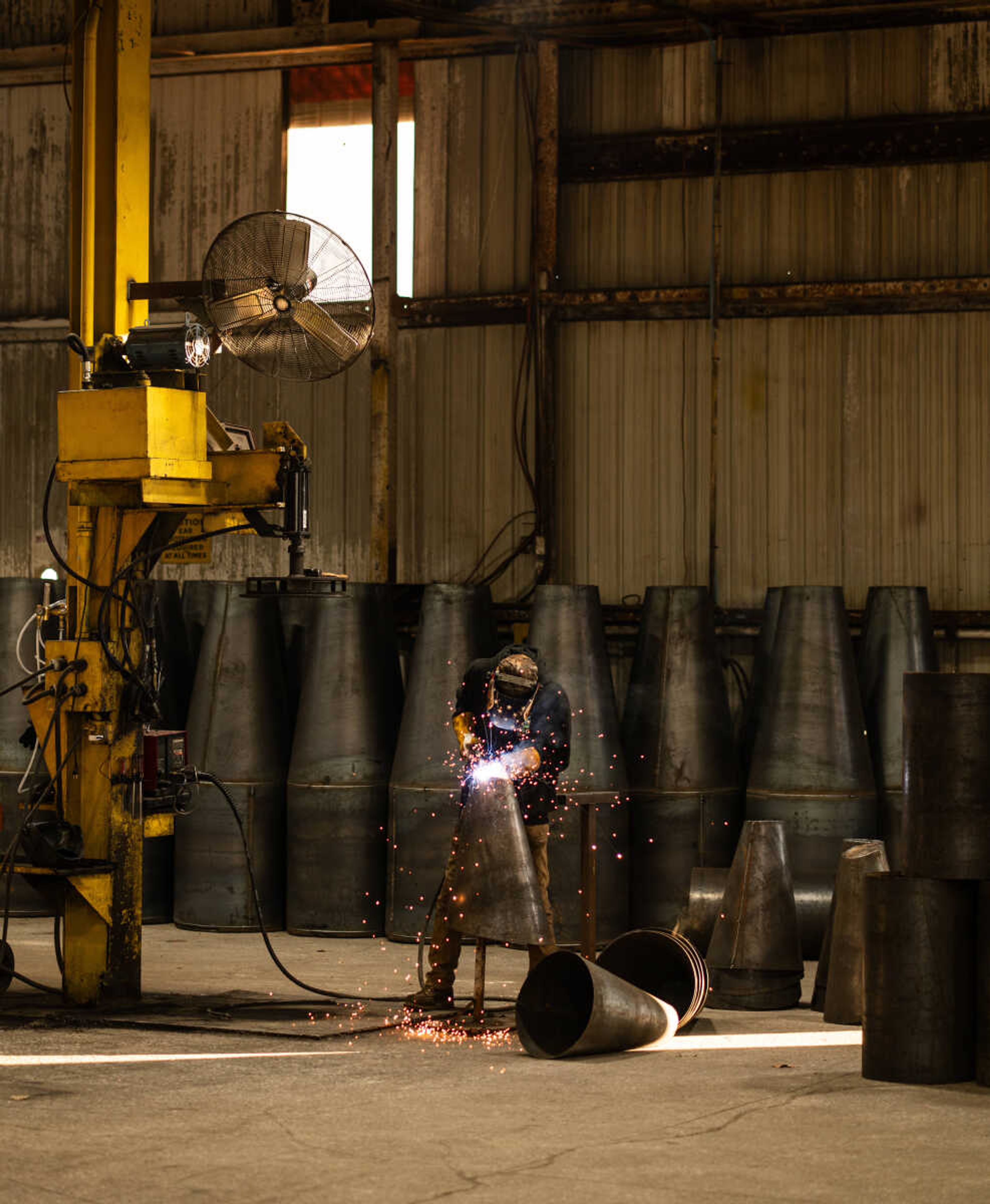 A welder seals up a cone-shaped piece for one of the buoys at H&G Marine in Perryville. H&G Marine produces buoys for the U.S. Coast Guard.