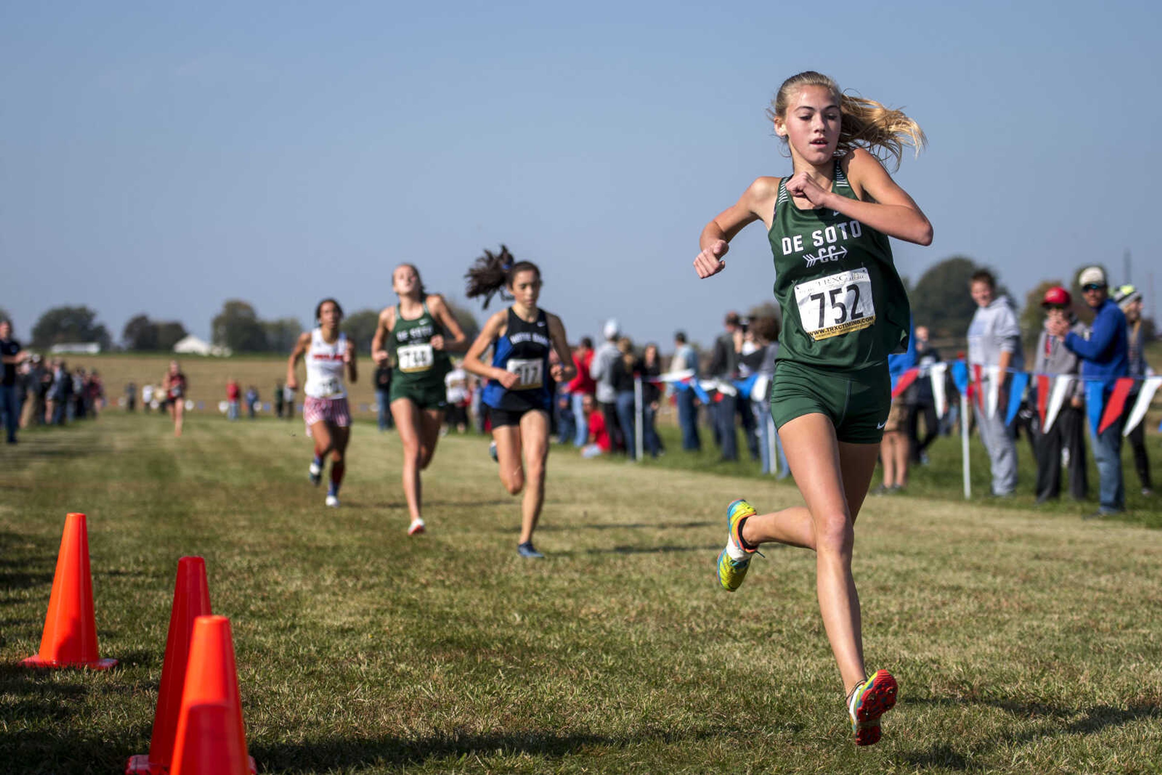 Kayla Vogelsang, right, crosses the finish line to win the Class 3 girls' race during a District cross-country meet at Notre Dame Regional High School Saturday, Oct. 27, 2018