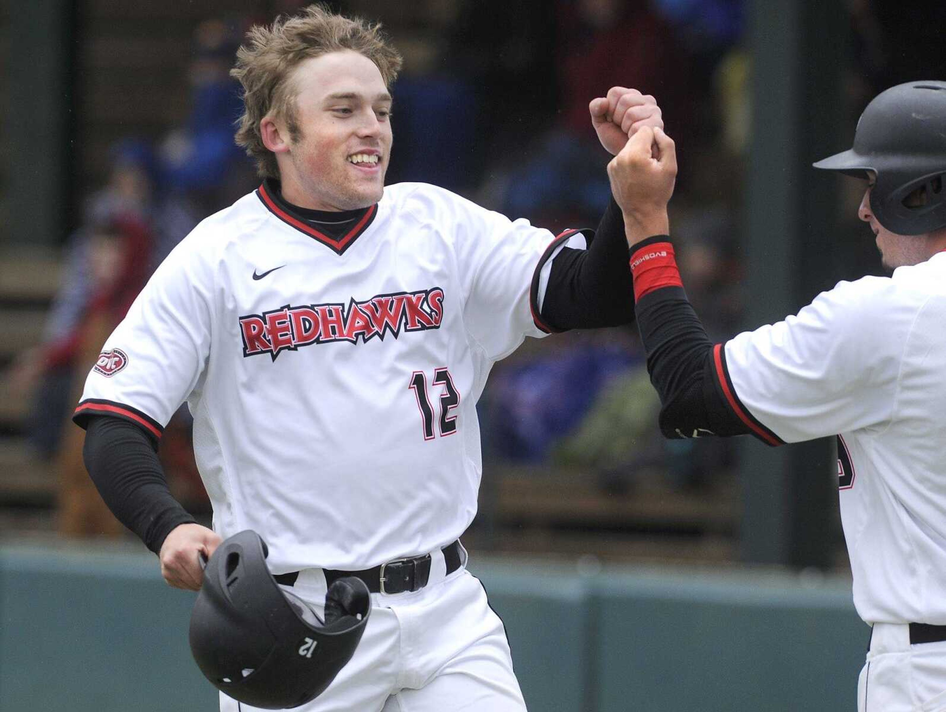 Southeast Missouri State's Trevor Ezell celebrates his solo home run against Morehead State with Branden Boggetto during the first inning Sunday, March 20, 2016 at Capaha Field.