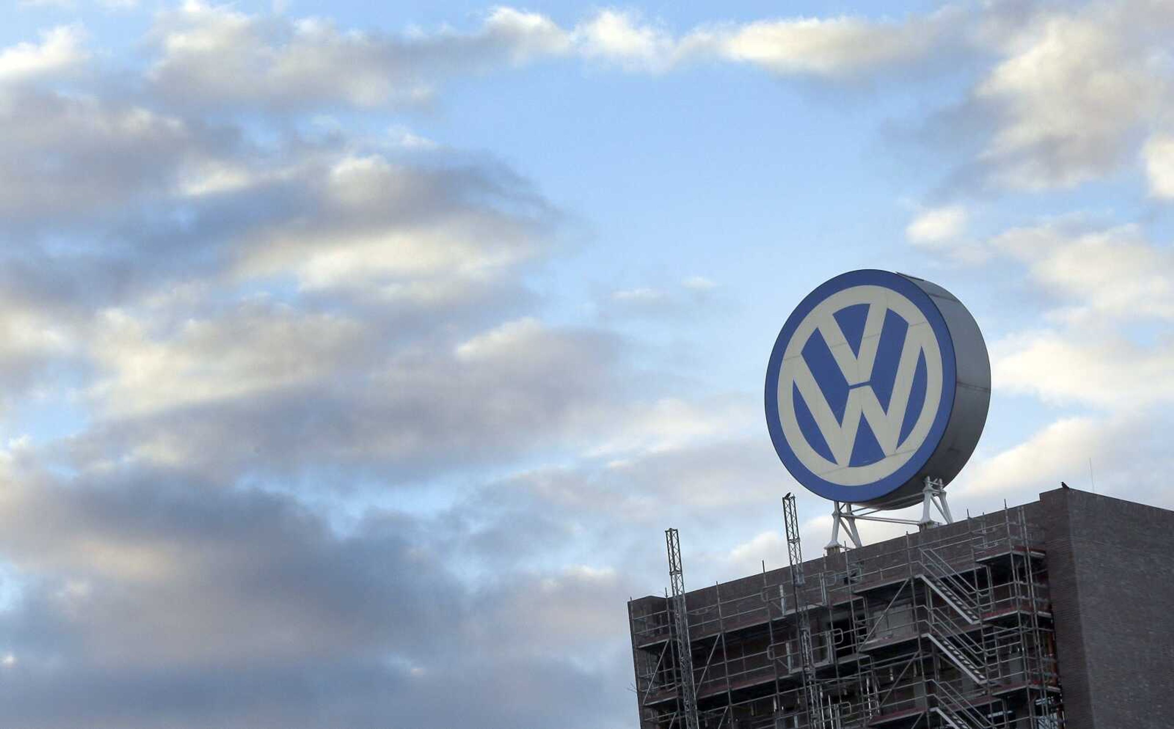 A giant logo of the German car manufacturer Volkswagen is pictured on top of a company's factory building in Wolfsburg, Germany.