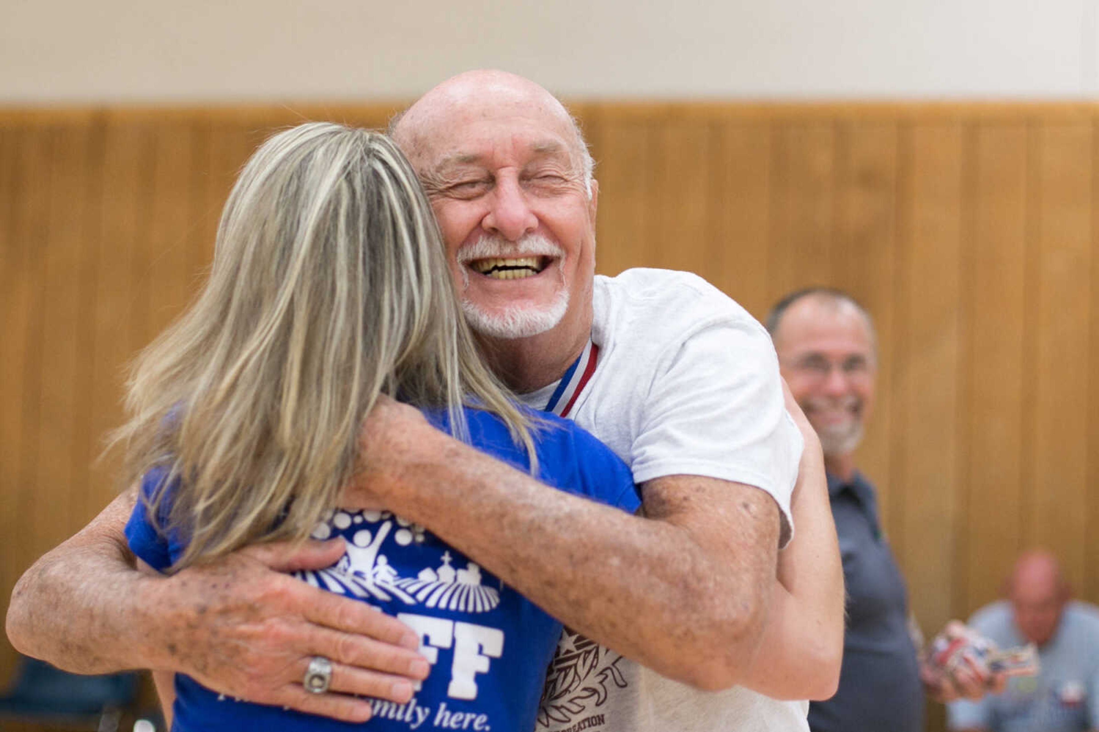 GLENN LANDBERG ~ glandberg@semissourian.com

Bill Cannon, 84, hands out a hug after receiving a metal during the first day of the Southeast Missouri Senior Games in Perryville, Missouri Wednesday, Aug. 19, 2015.