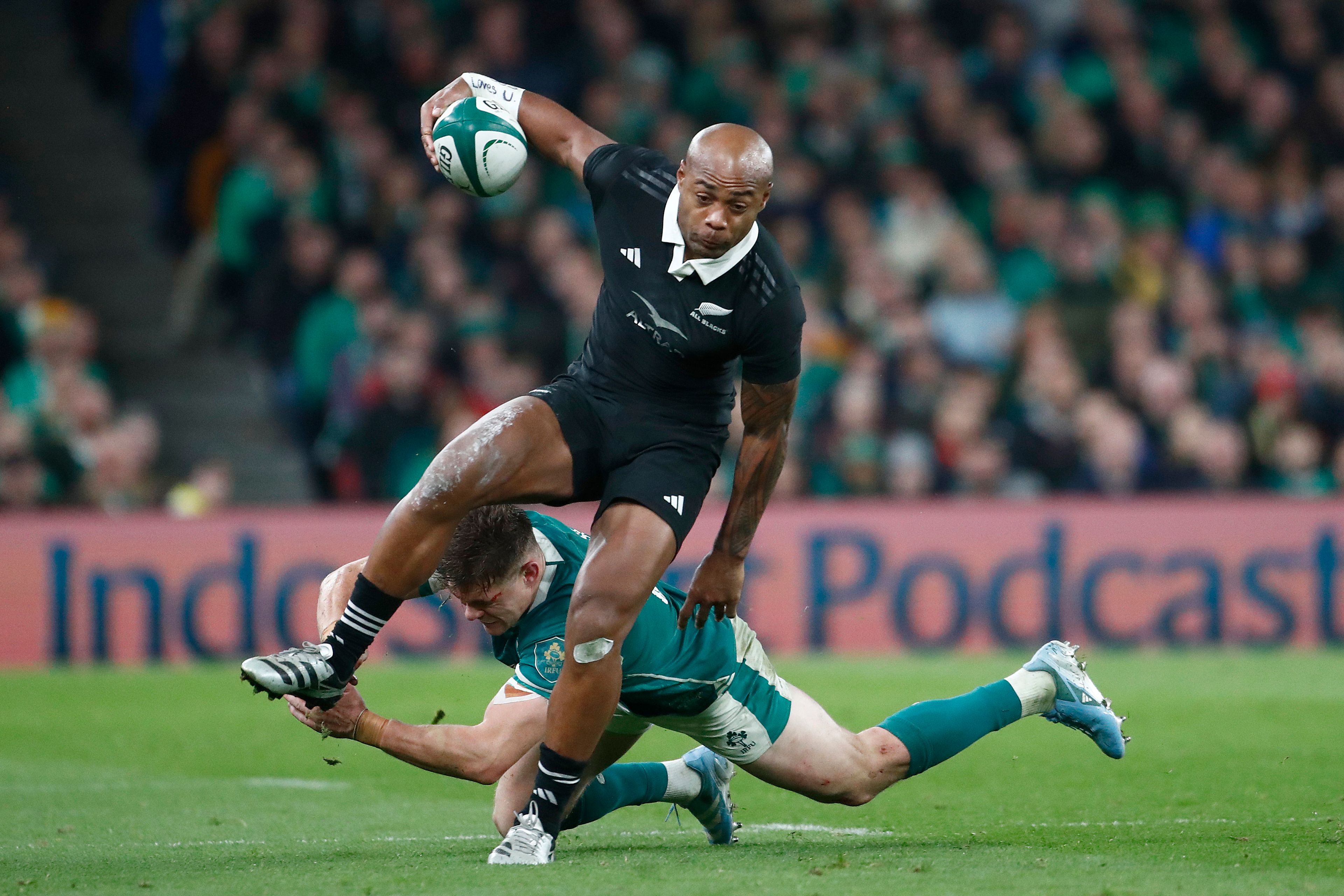 New Zealand's Mark Tele'a, is tackled by Ireland's Garry Ringrose, during the the Autumn Nations series rugby union match between Ireland and New Zealand at the Aviva Stadium in Dublin, Ireland, Friday, Nov. 8, 2024. (AP Photo/Peter Morrison)