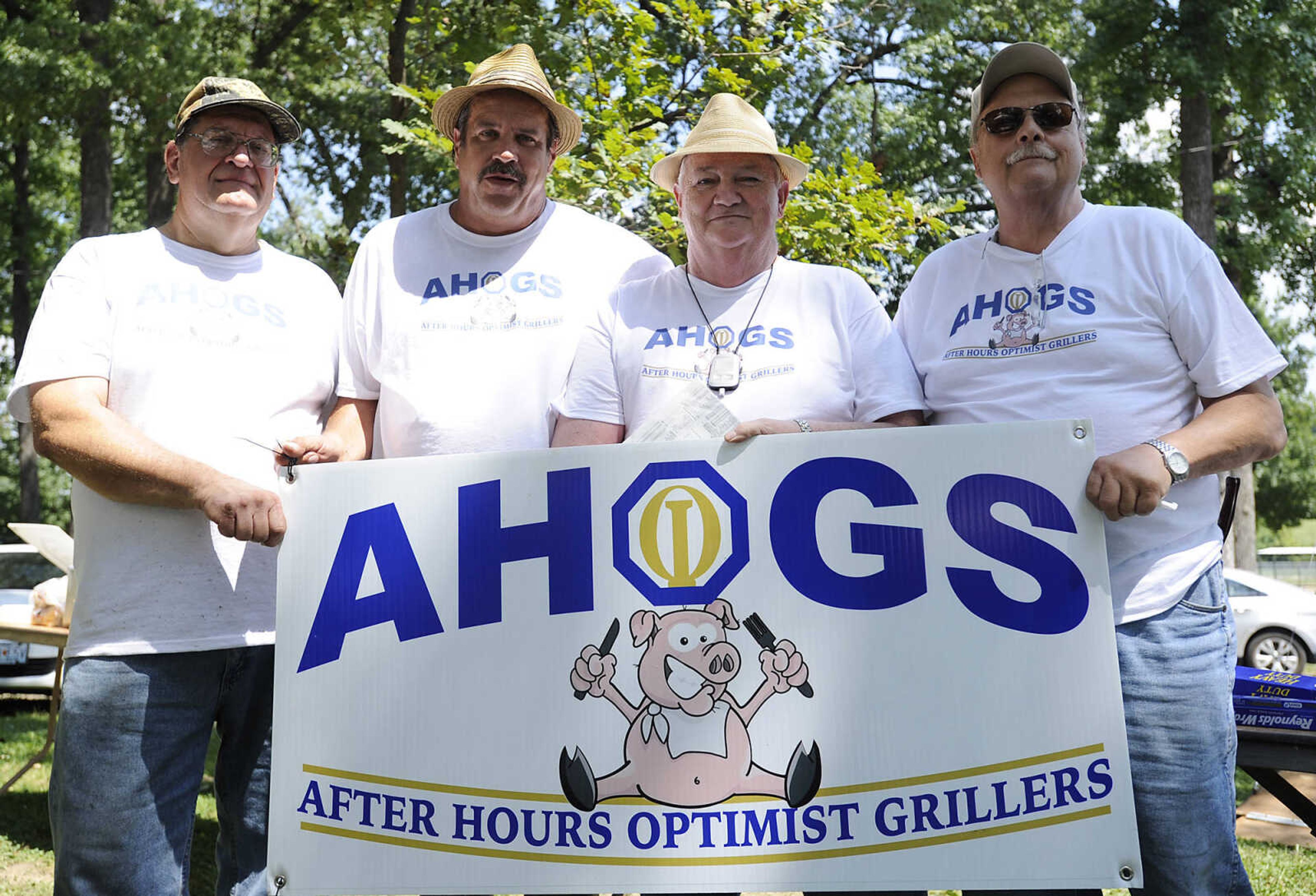 The After Hours Optimist Grillers, Robert Blasiney, left, Jeff King, Leonard Hines, and Mike Hurst during the 21st annual Cape BBQ Fest Saturday, Aug. 24, at Arena Park in Cape Girardeau.