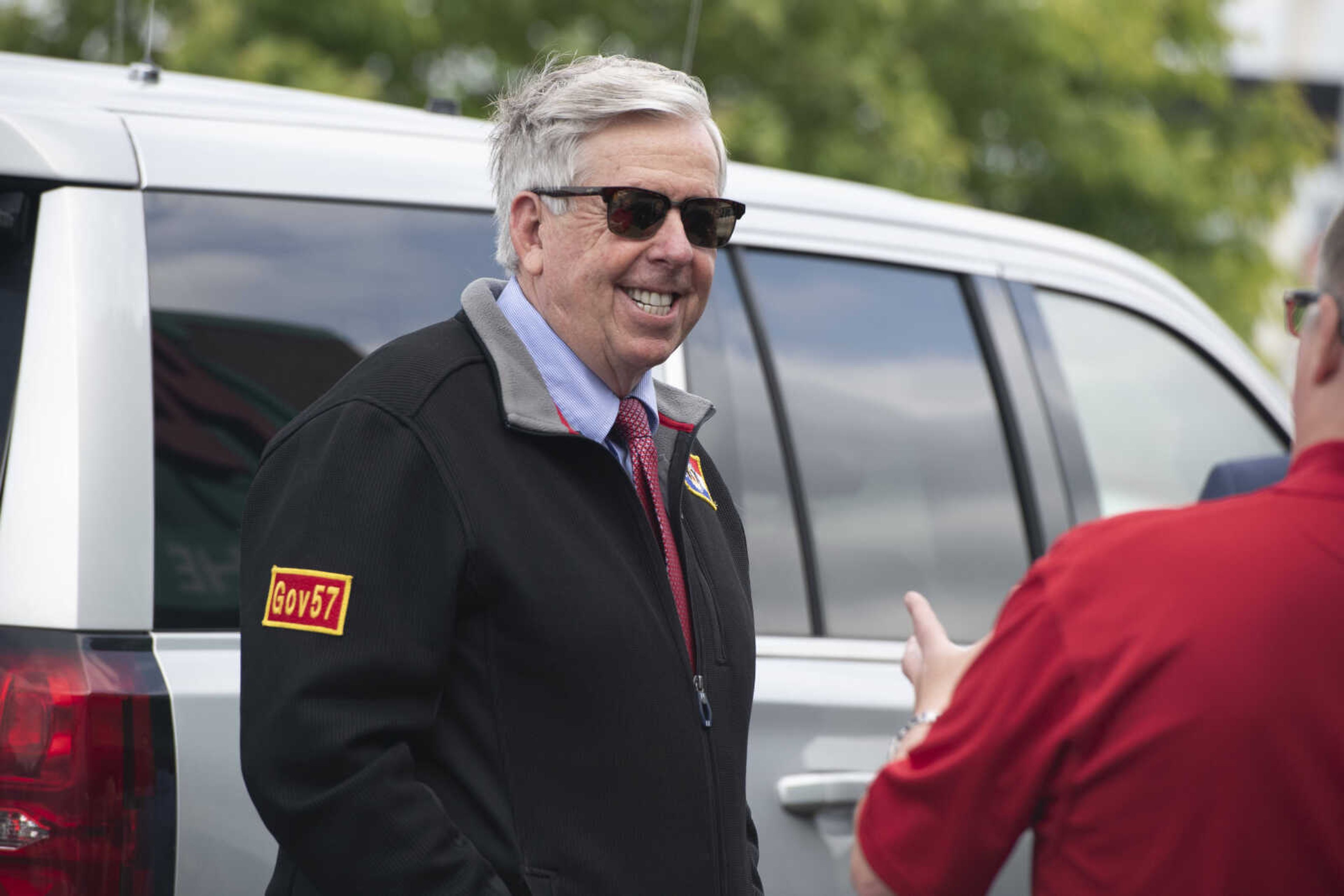 Missouri Gov. Mike Parson smiles while making a visit Thursday, May 14, 2020, at Plaza Tire Service in Cape Girardeau.