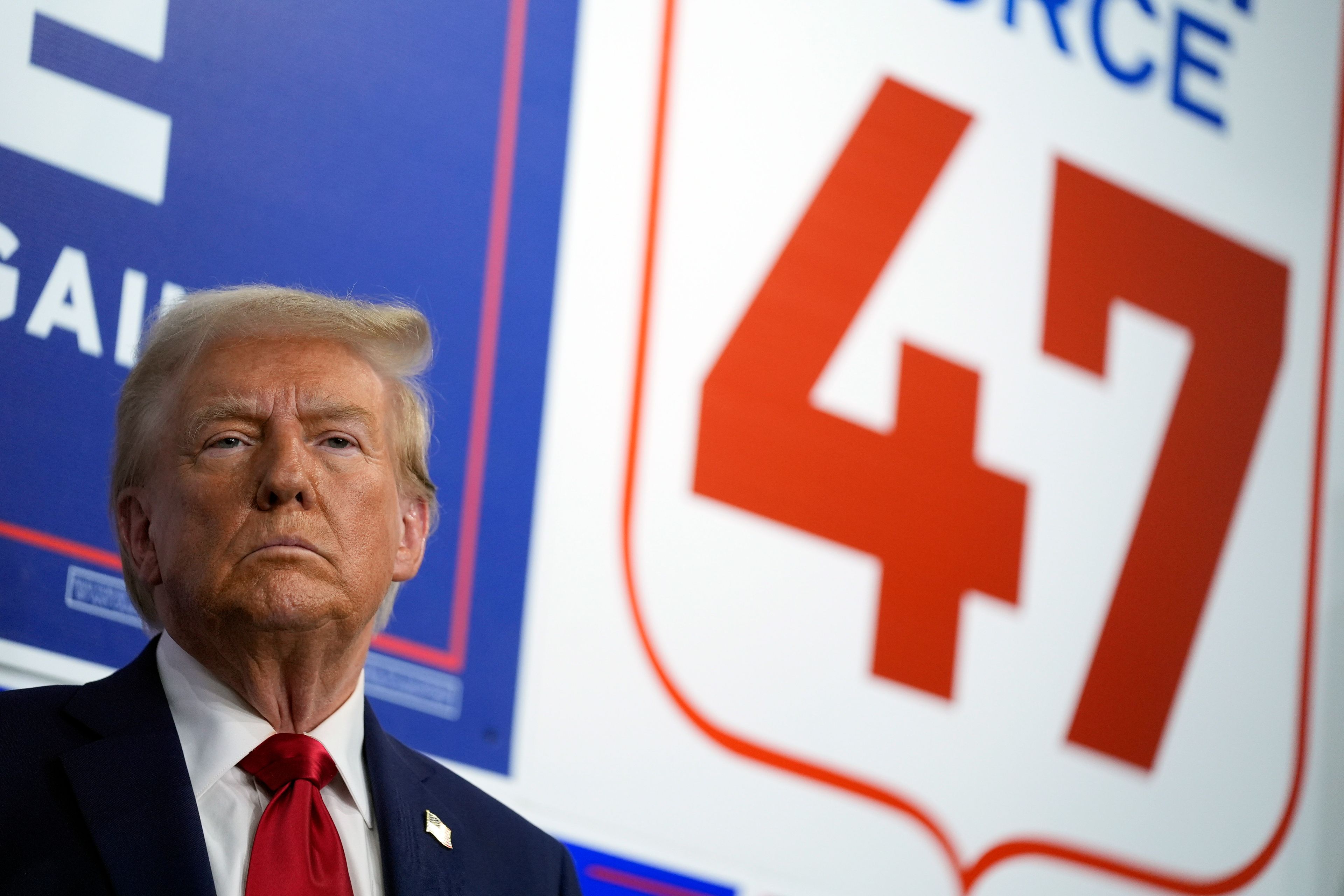 Republican presidential nominee former President Donald Trump listens as he visits a campaign office, Friday, Oct. 18, 2024, in Hamtramck, Mich. (AP Photo/Evan Vucci)