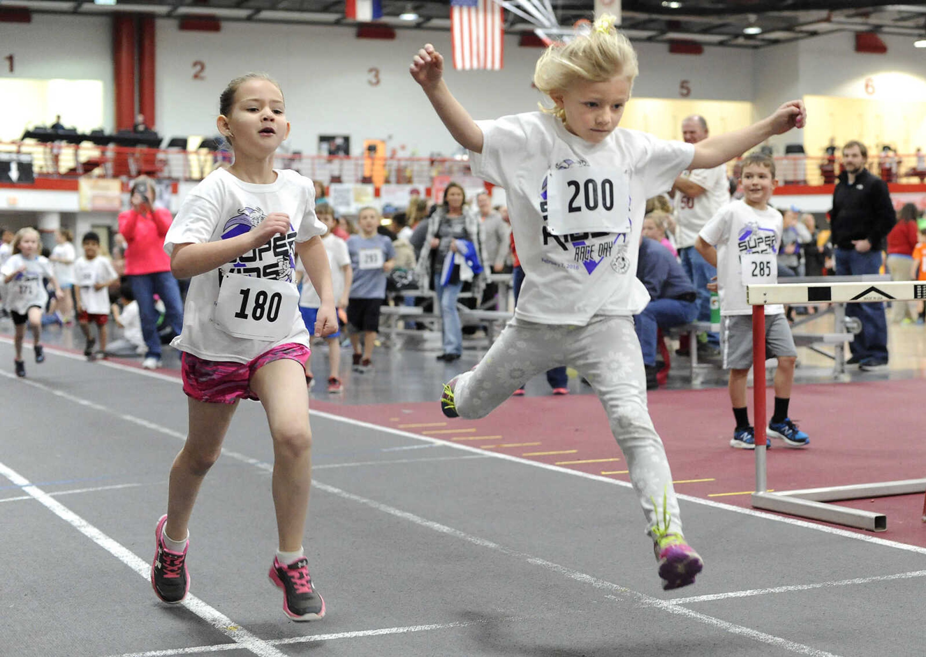 FRED LYNCH ~ flynch@semissourian.com
Piper Landgraf, right, finishes ahead of Kinley Couch in a 200-meter race for 6-year-old girls during the Super Kids Race Day on Sunday, Feb. 7, 2016 at the Student Recreation Center.