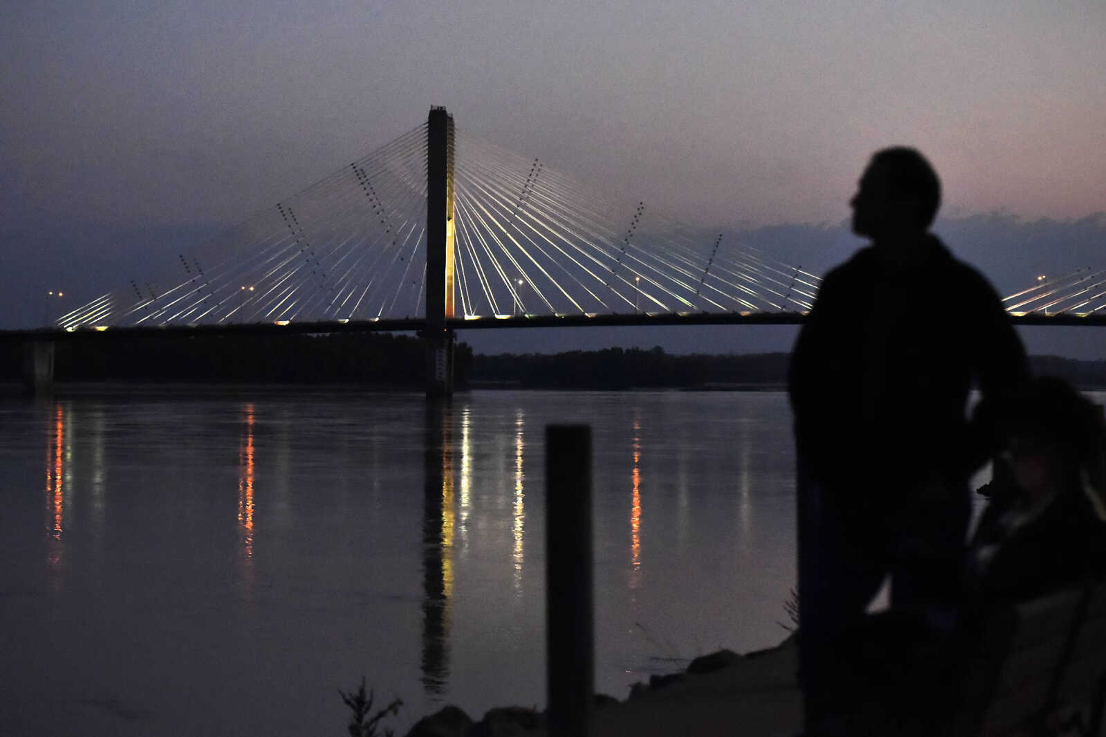 LAURA SIMON ~ lsimon@semissourian.com

Visitors to the Riverfront Park in downtown Cape Girardeau wait for the super moon to rise in the east Monday evening, Nov. 14, 2016. The moon gave a quick show as it rose just about the tree line on the Illinois side of the Mississippi River before ducking behind clouds for a time.