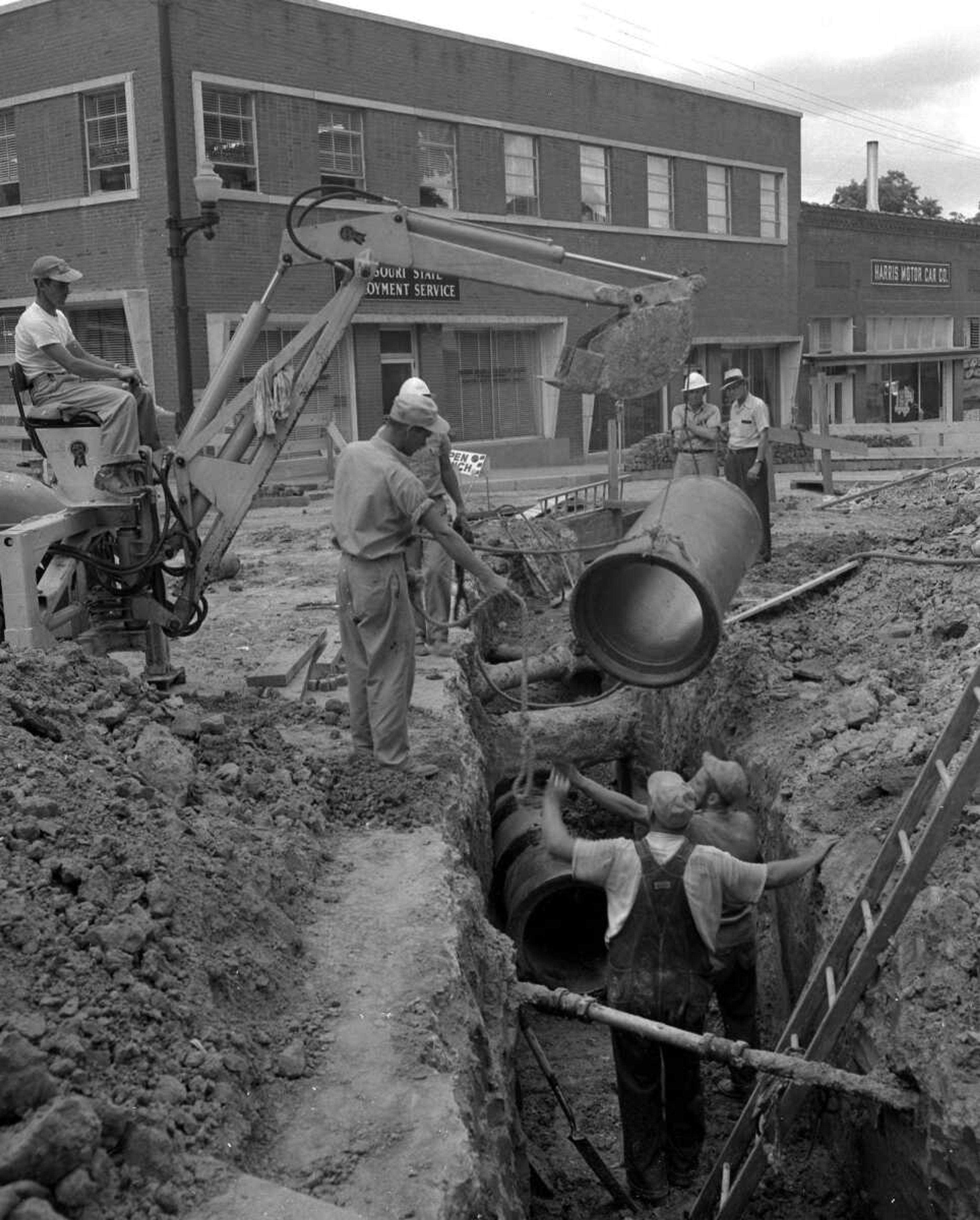 Workers installed pipes for a new sewer system at Broadway and Lorimier Street.