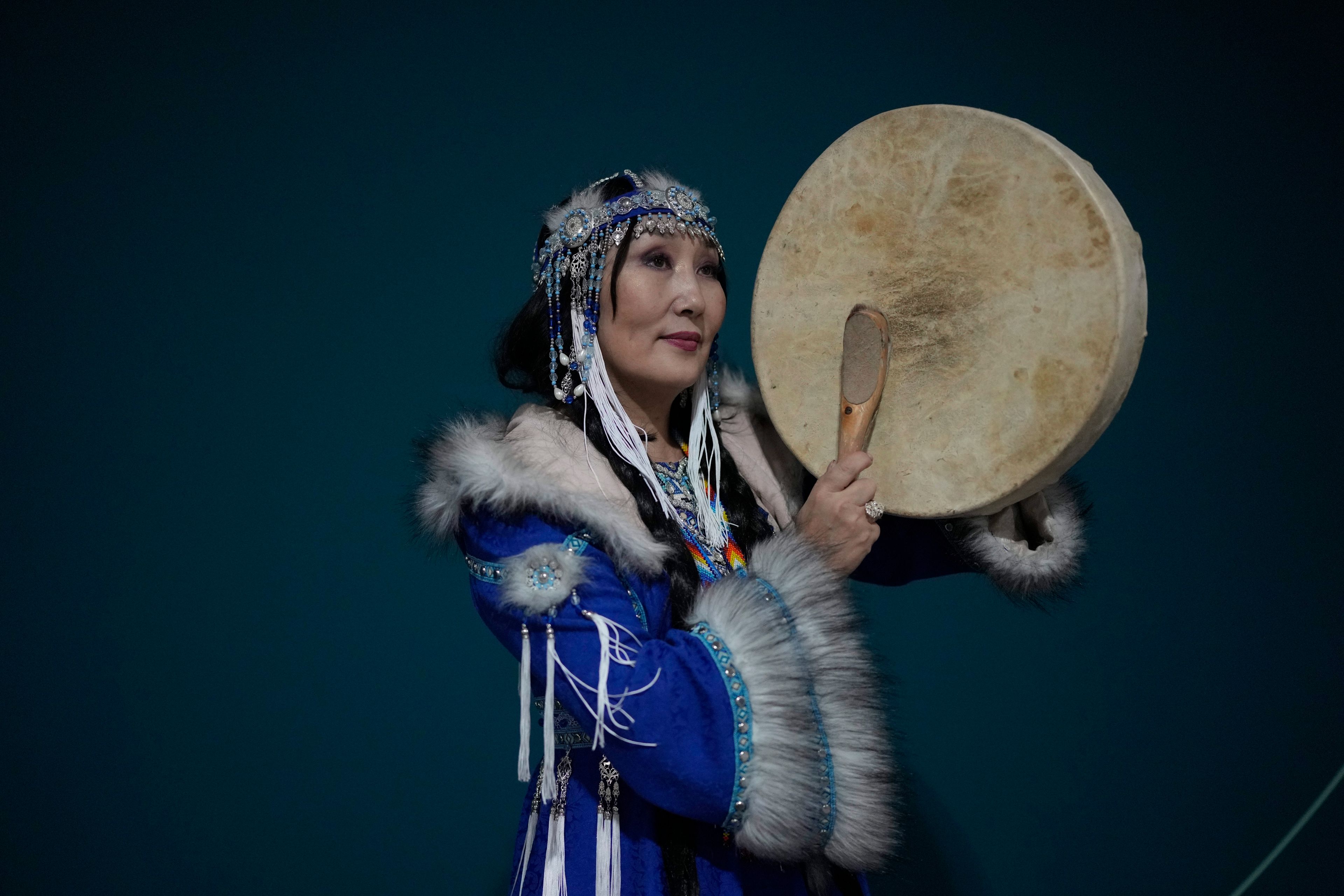 Saina Ekaterina Savvinova, 53, of Yakutsk, Russia, from the Yakut community, poses for a photo poses during the COP29 U.N. Climate Summit on Wednesday, Nov. 13, 2024, in Baku, Azerbaijan. (AP Photo/Rafiq Maqbool)