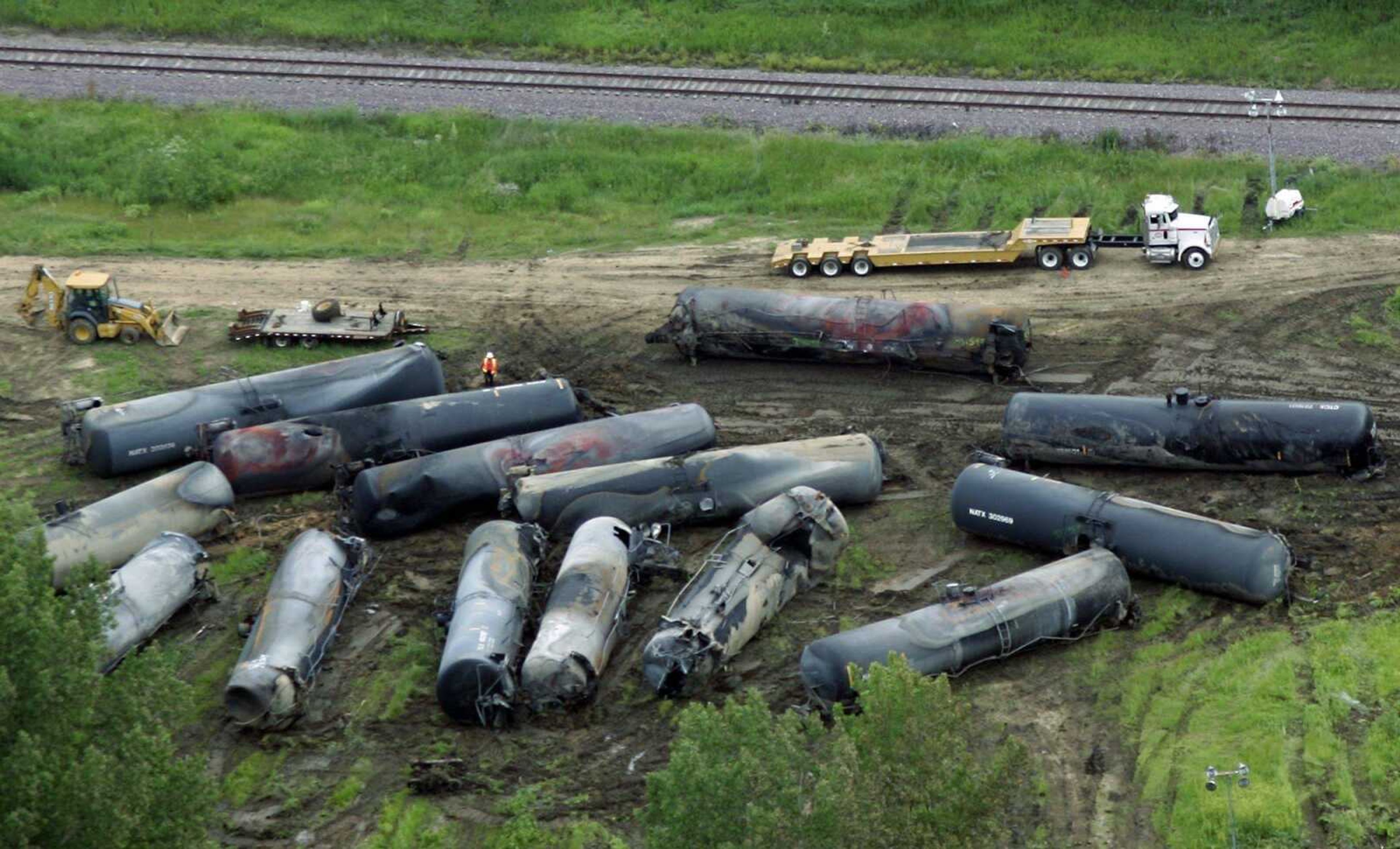 In this Sunday, June 21, 2009, aerial photo are railroad cars damaged in a fiery explosion that killed one person following a freight train derailment Friday in Rockford, Ill. Federal regulators have been exploring ways to deal with shipments of hazardous materials, like ethanol, but part of their solution _ sending trains carrying hazardous freight on routes away from big cities _ has suburban and smaller communities crying foul. (AP Photo/Rockford Register Star, Scott Morgan)