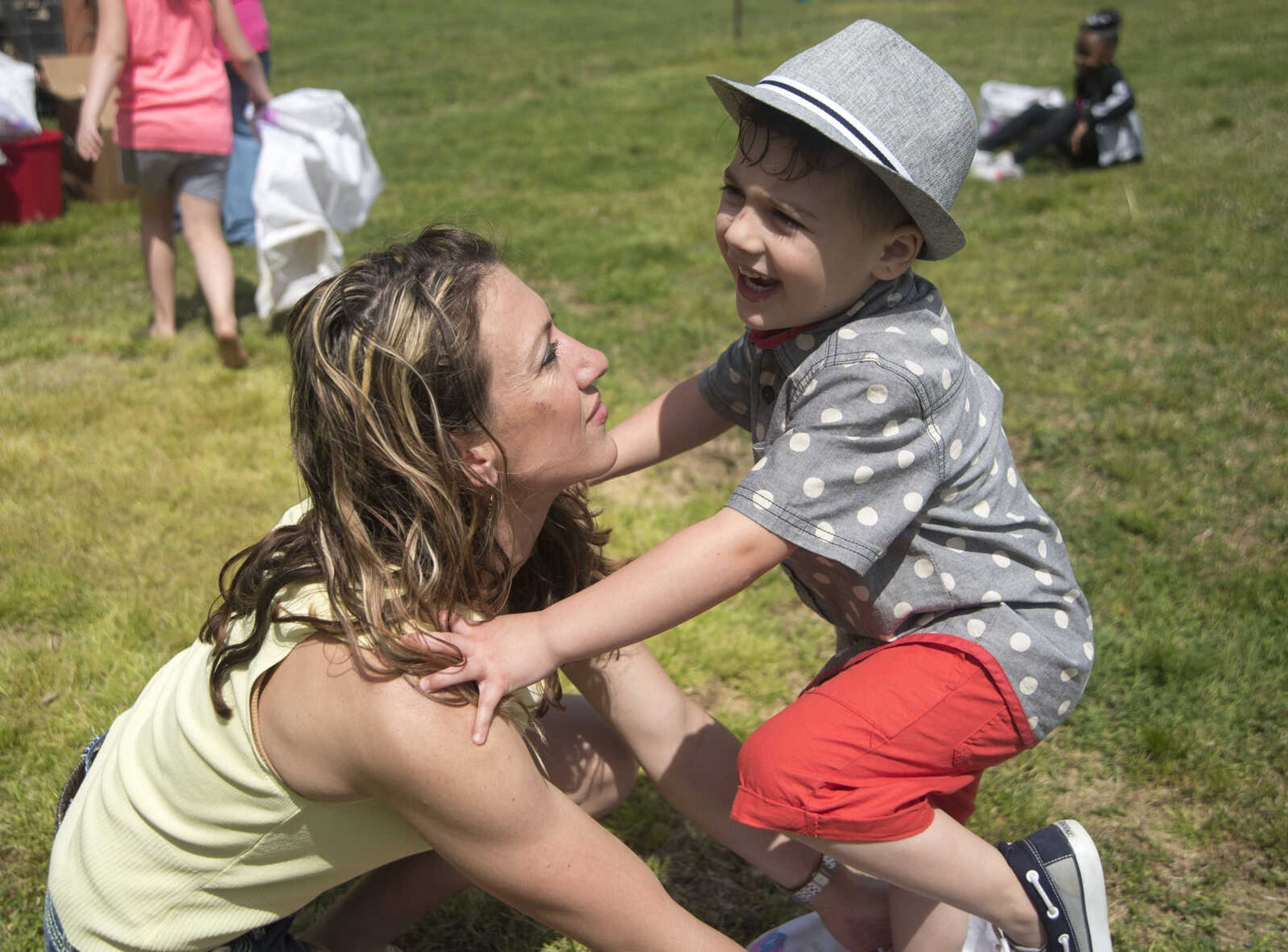 Liam McGill, 4, runs towards his mother Casie McGill after competing in the sack race during the Safari Egg Hunt Saturday, April 15, 2017 at Lazy L Safari Park in Cape Girardeau.