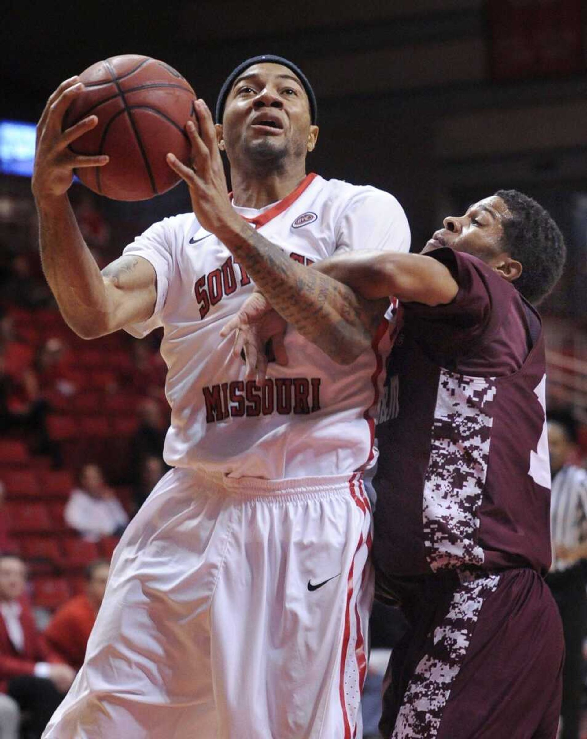 Southeast Missouri State's Josh Langford tries to shoot but is fouled by Alabama A&M's Rakiya Battle during the first half Saturday, Nov. 29, 2014 at the Show Me Center. (Fred Lynch)