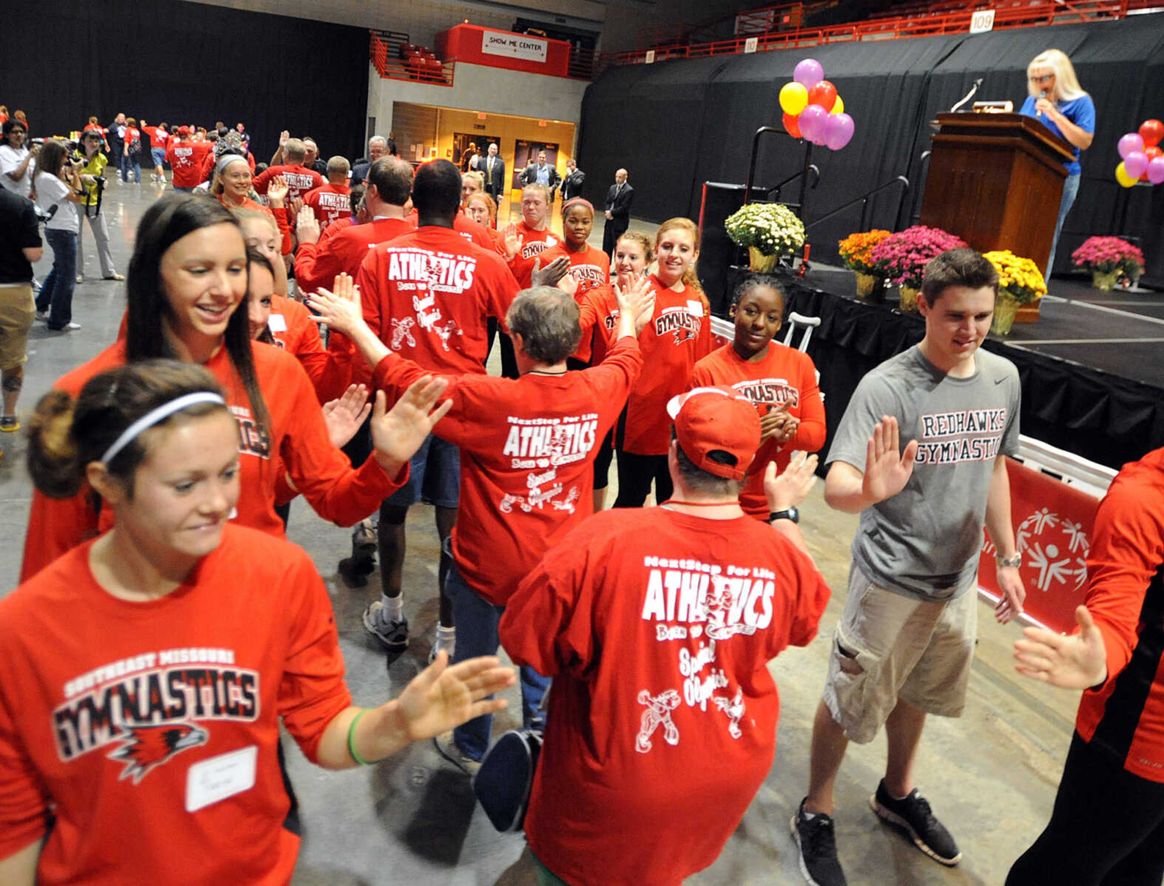 LAURA SIMON ~ lsimon@semissourian.com

Special Olympic athletes are greeted by fans, the Knights of Columbus, and the Southeast Missouri State gymnastics team, Friday, Oct. 11, 2013 during the opening ceremony for the Special Olympics Missouri State Fall Games at the Show Me Center.