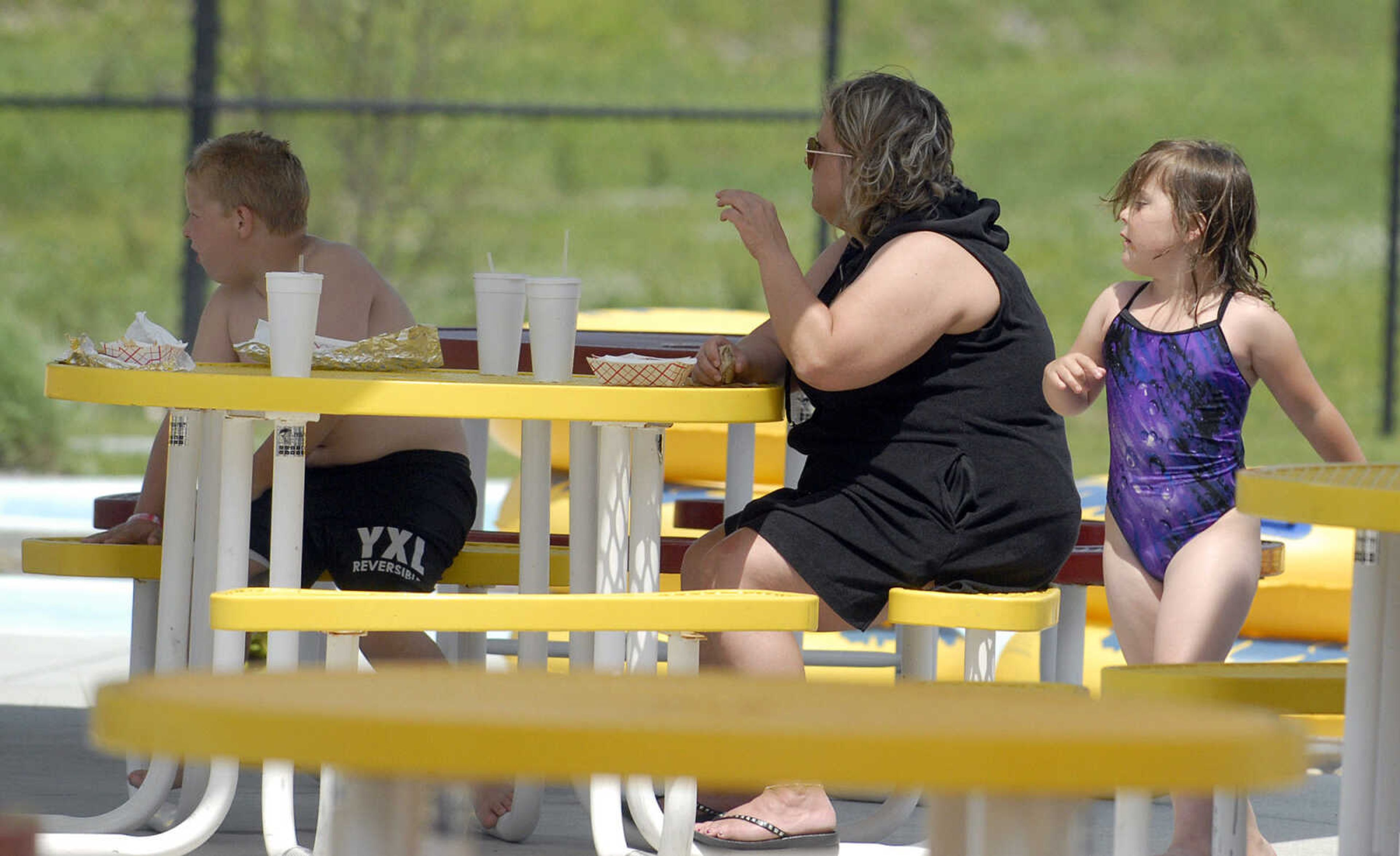 LAURA SIMON~lsimon@semissourian.com
Kellie Bridges and her children Noah and Mindy take a break from the water Saturday, May 28, 2011 during opening day of Cape Splash Family Aquatic Center in Cape Girardeau.