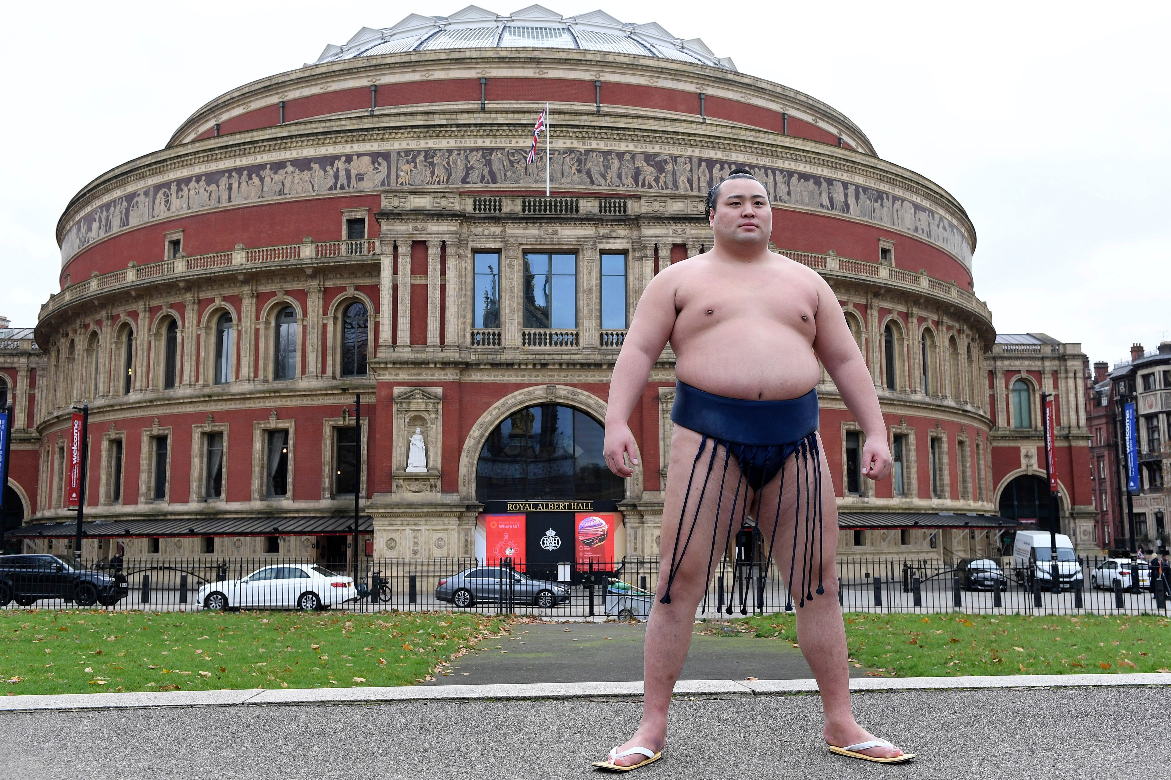 Rishikis from Japan's Sumo Kyokai, Daisuke Kitanowaka poses for a photo call outside of London's Royal Albert Hall, where the UK's second ever official basho will take place in October of next year in London, Wednesday, Dec. 4, 2024.(AP Photo/Thomas Krych)