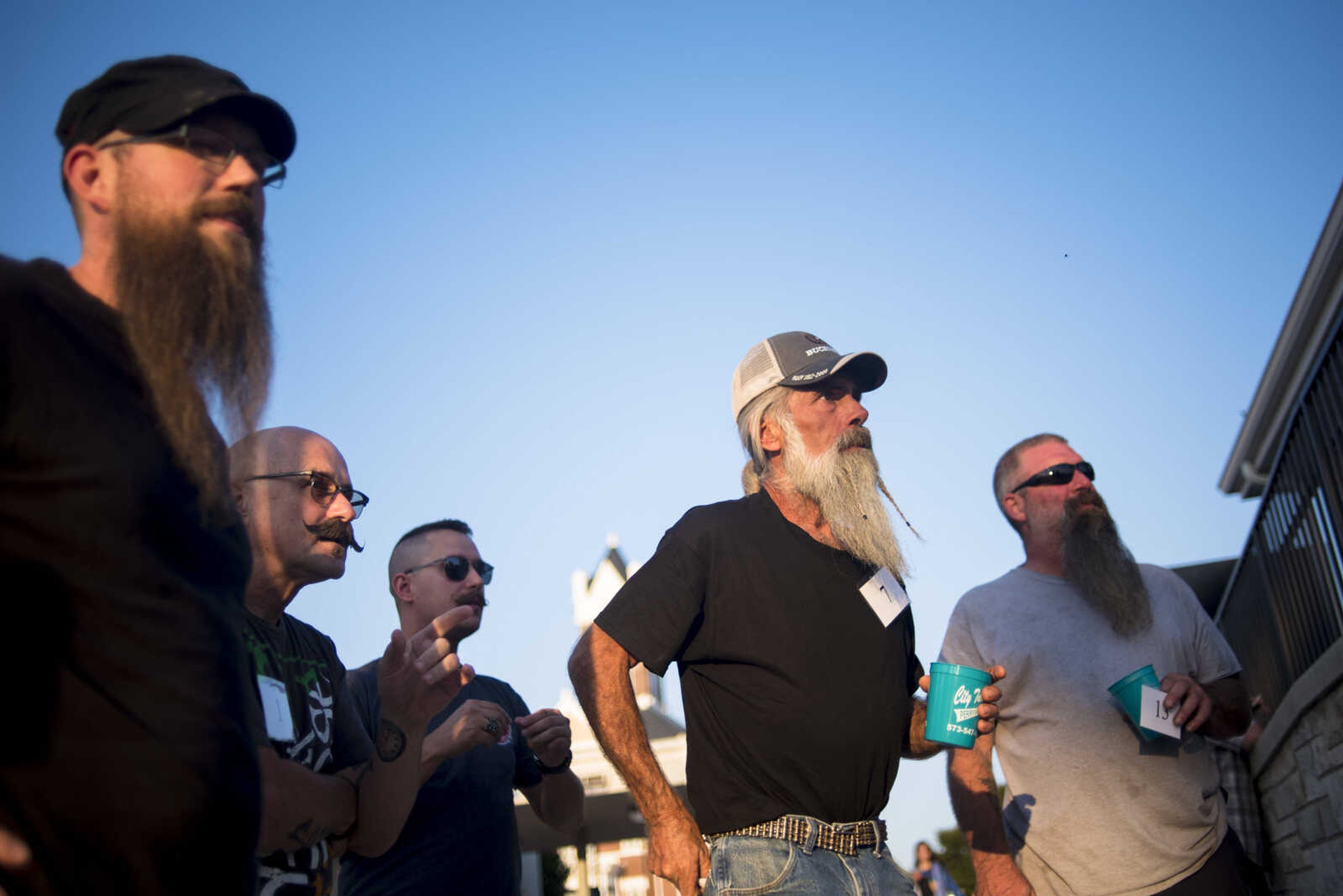 Bearded men wait backstage for the facial hair contest during the Perryville Pinup contest Saturday, Sept. 2, 2017 in downtown Perryville.