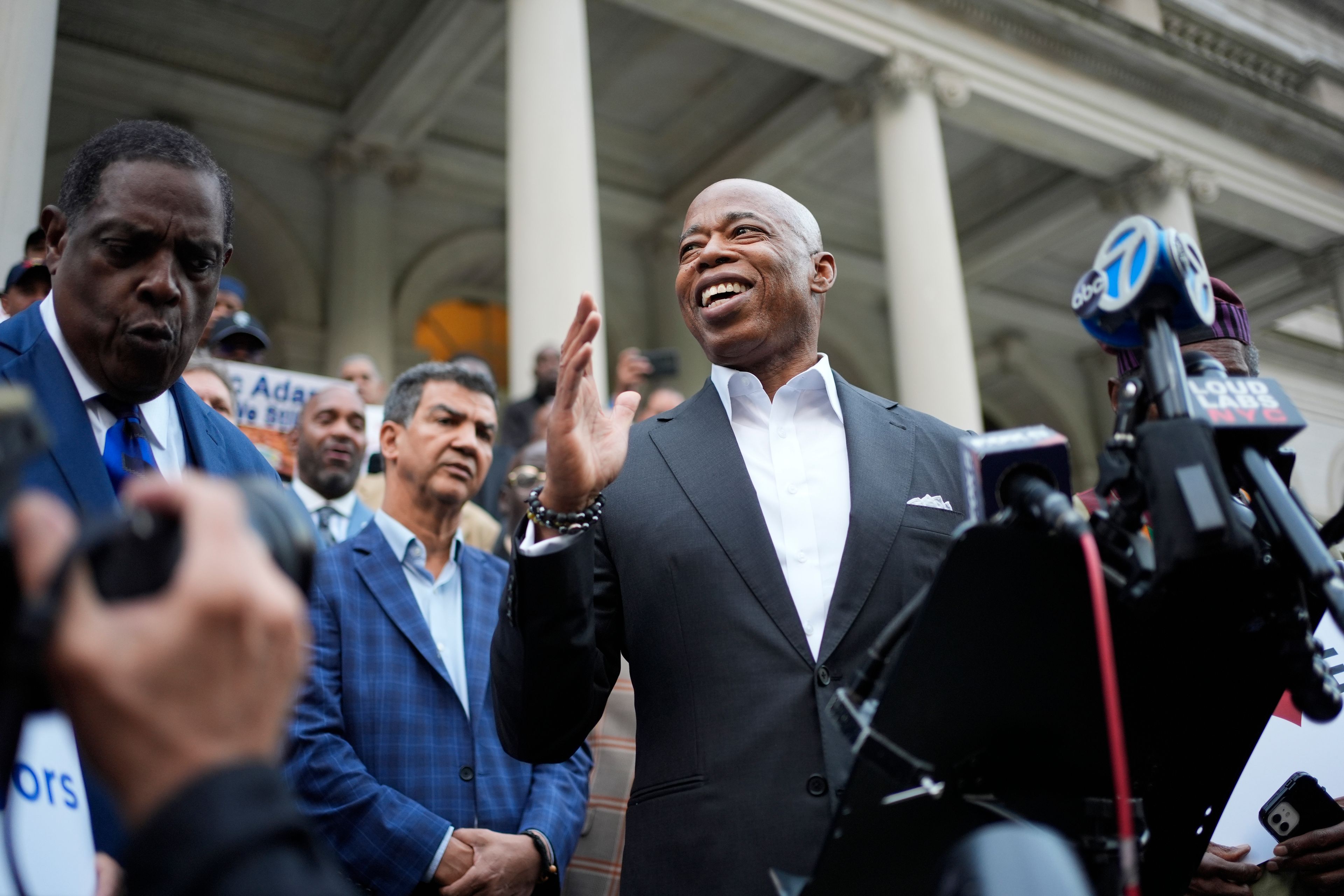 New York City Mayor Eric Adams speaks while surrounded by faith leaders and other supporters during a rally and prayer vigil on the steps of City Hall in New York, Tuesday, Oct. 1, 2024. (AP Photo/Seth Wenig)