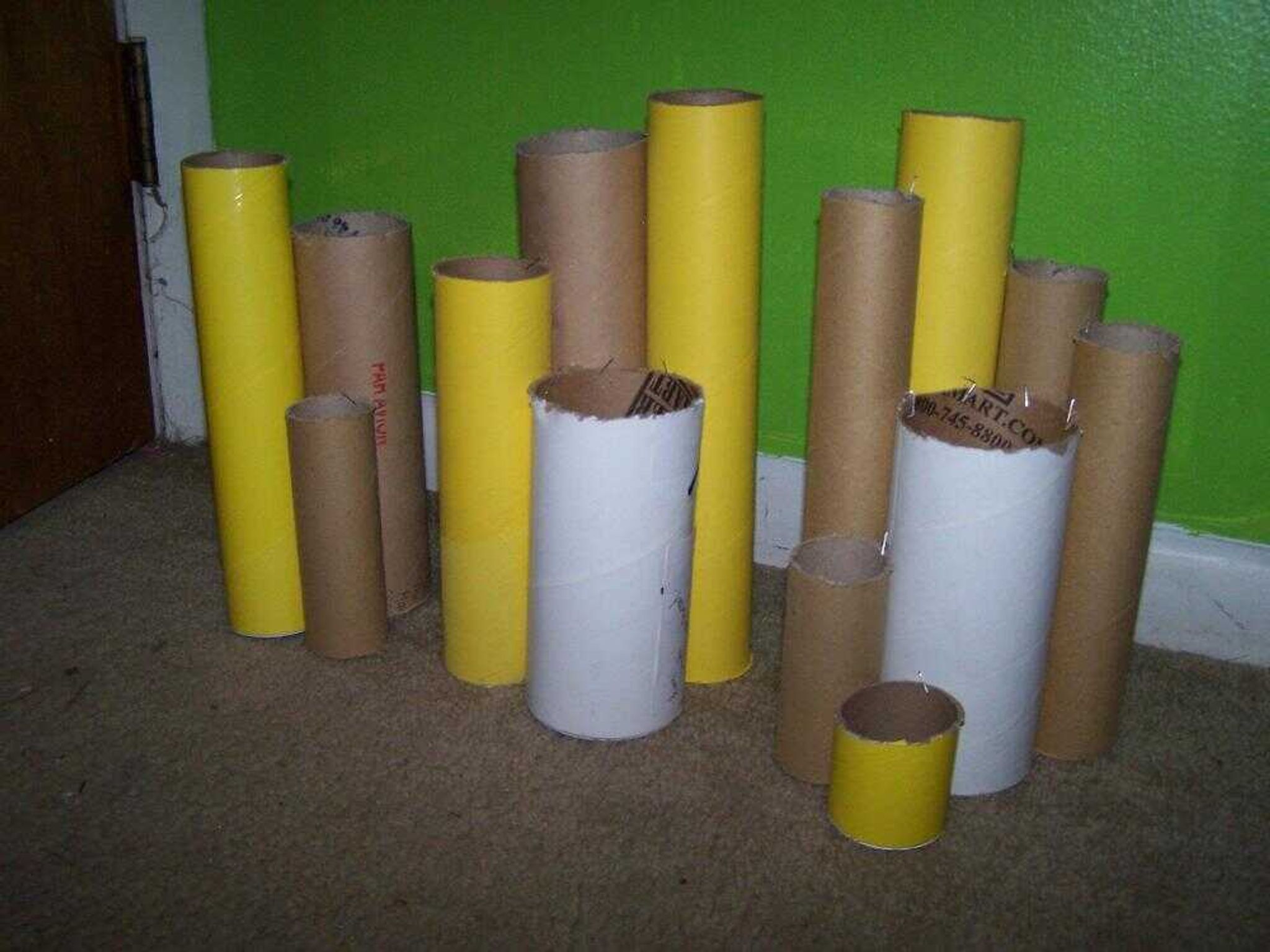 Mailing tubes, top, were cut to different lengths, above, for a variety purposes from holding pens on a desktop to storing household items. (Vanessa Cook)