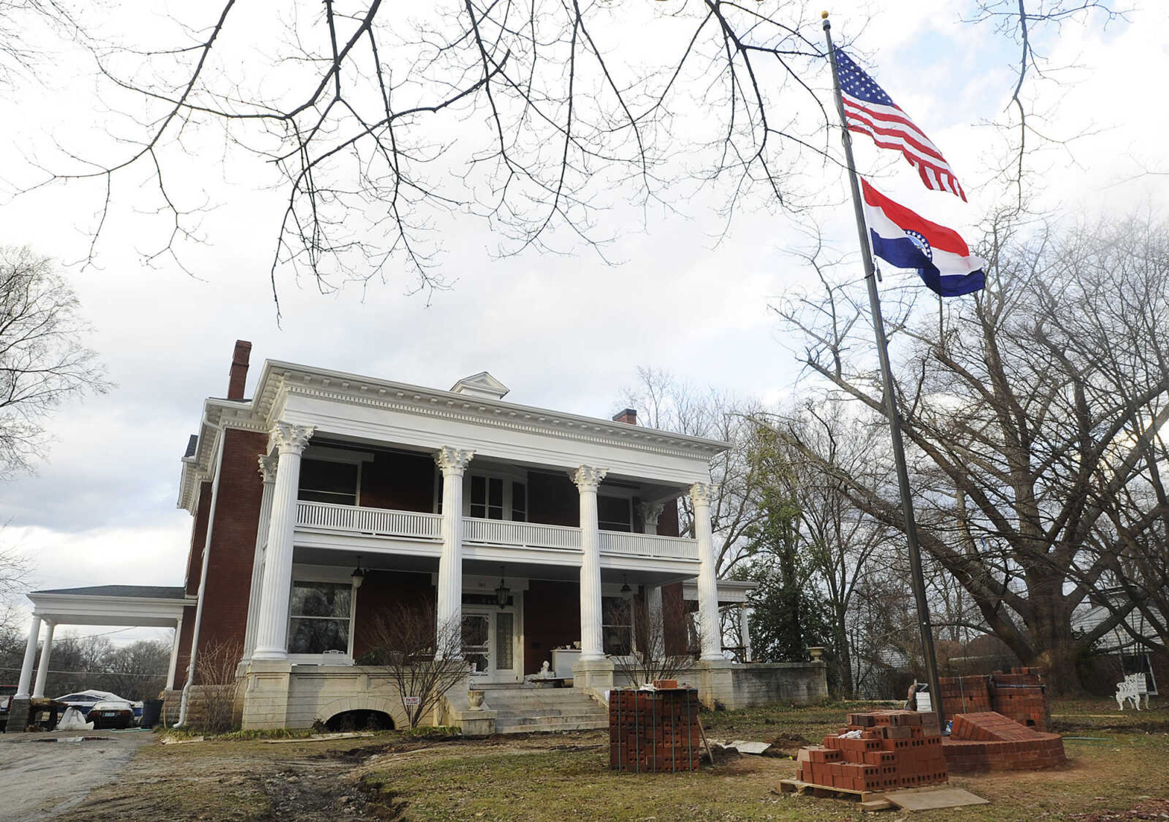 ADAM VOGLER ~ avogler@semissourian.com
The Missouri state flag flies, Tuesday, March 12, outside of the  Oliver-Leming House, 740 North Street, in Cape Girardeau. The flag was designed in the house in 1913 by Marie Watkins Oliver, wife of state Senator R.B. Oliver. The home is now owned by Drs. Bert and Mary Ann Kellerman and will be featured in a three-day Missouri Flag Centennial Celebration scheduled for March 21 through March 23.