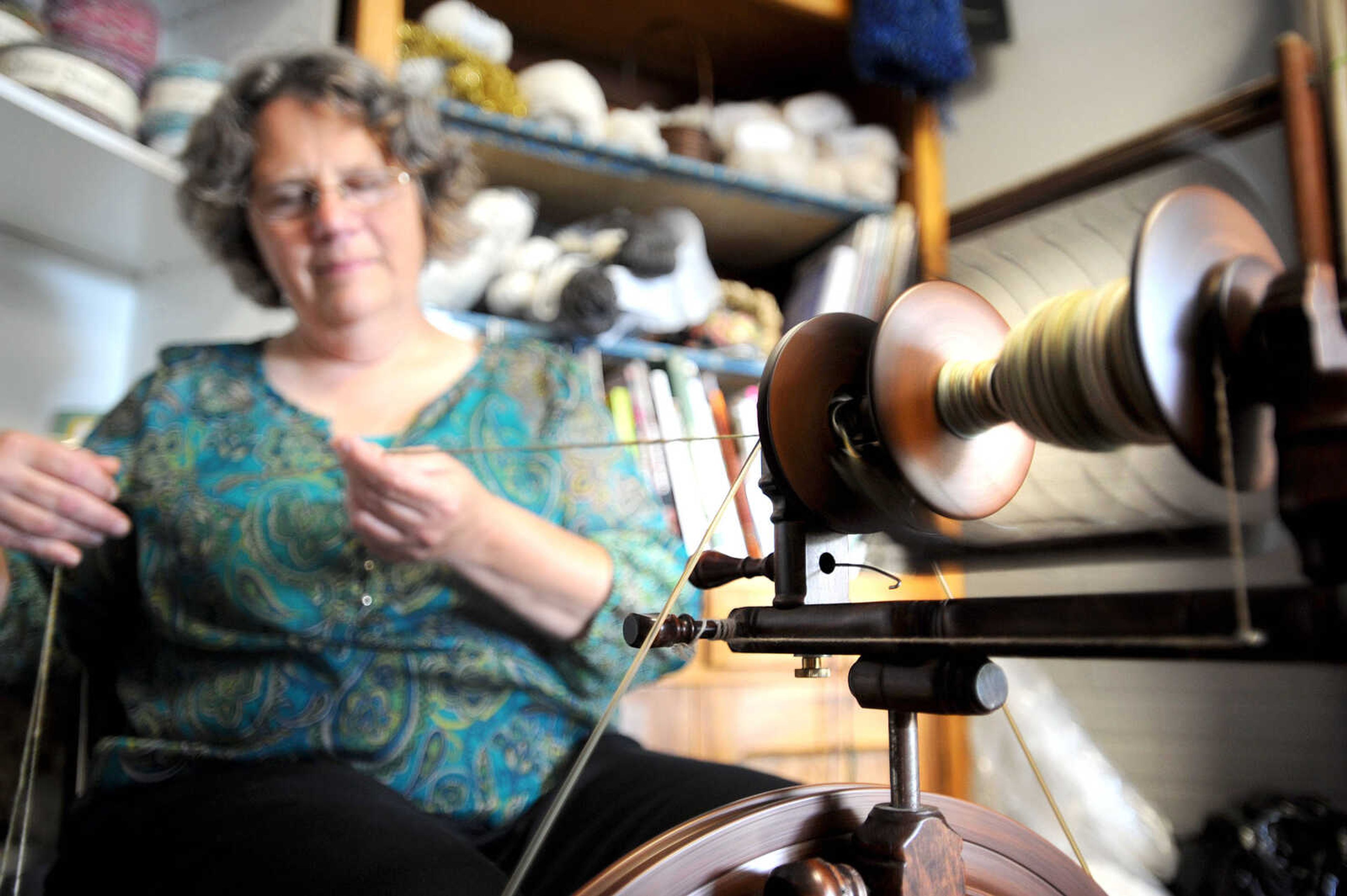 Dawn Flickinger combines together two different types of yarn inside her downtown Cape Girardeau shop, Yearning 4 Yarn. (Laura Simon)