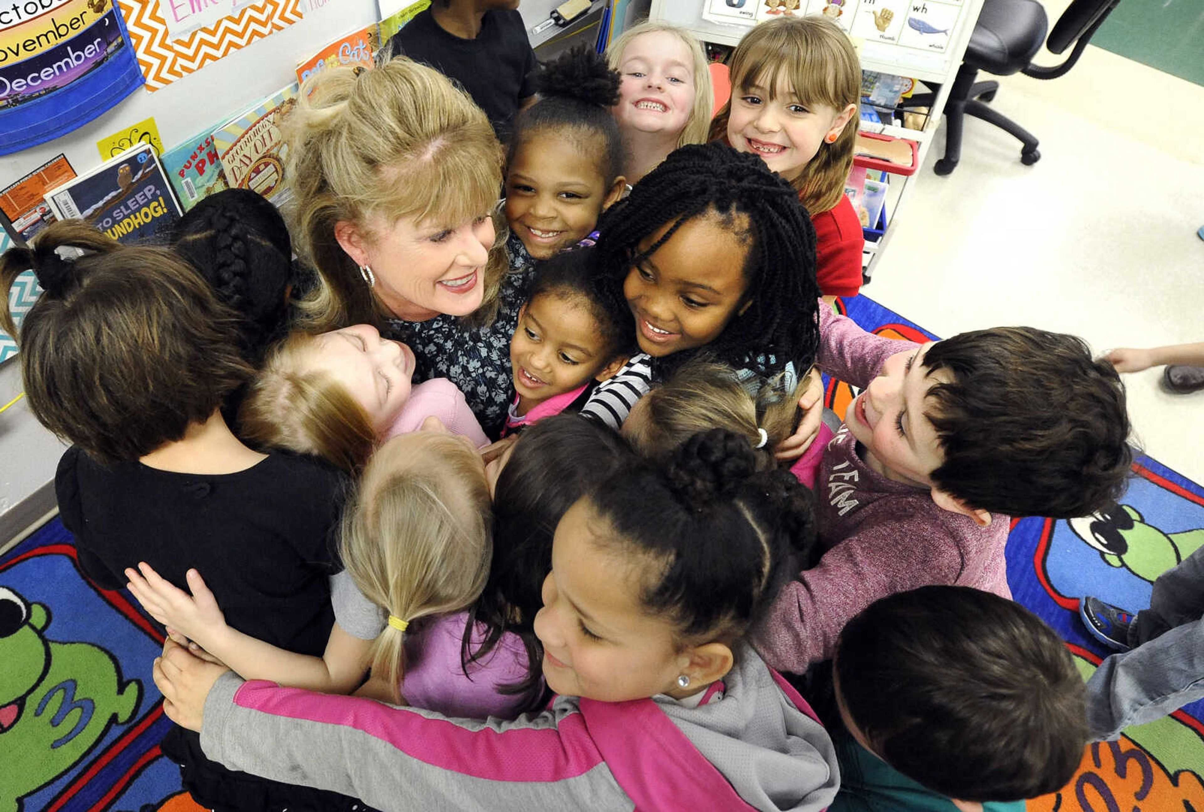 LAURA SIMON ~ lsimon@semissourian.com

Kindergarten students surround Blanchard Elementary principal, Barbara Kohlfeld, for a group hug, Monday, Feb. 8, 2016. The Cape Girardeau school was named a National Blue Ribbon School by the U.S. Department of Education.