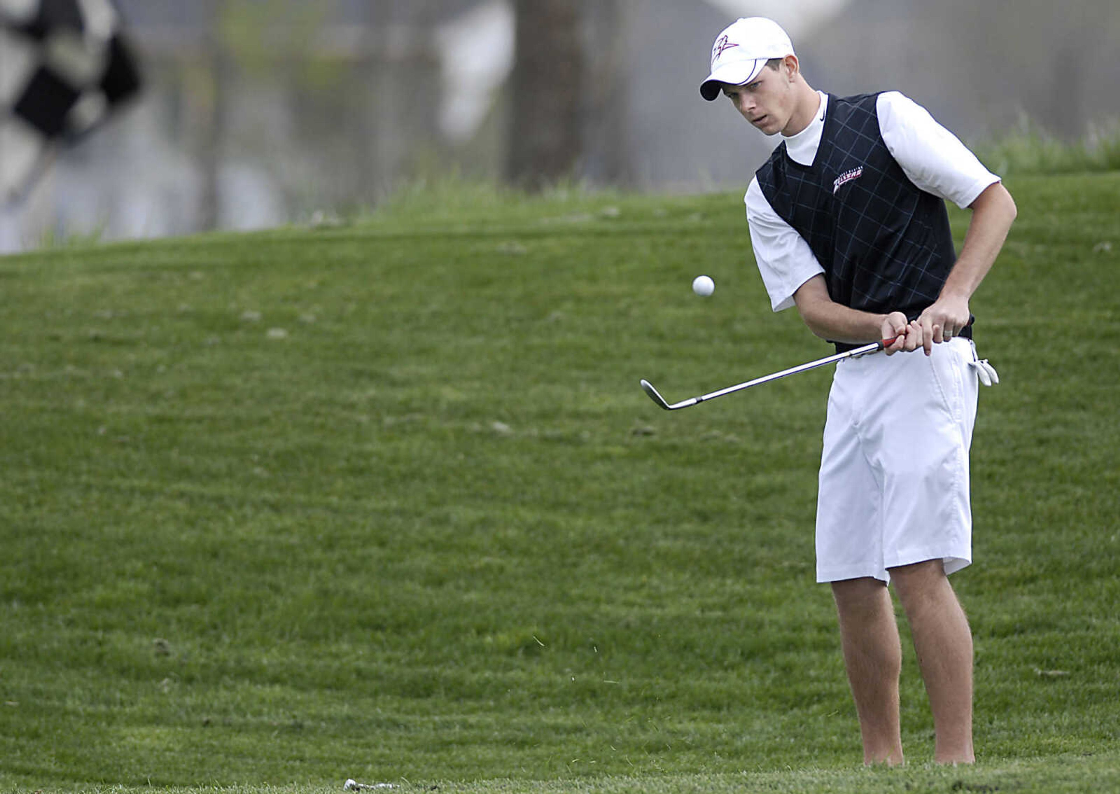 KIT DOYLE ~ kdoyle@semissourian.com
West Plains' Dillon Crow watches his chip on the first hole Thursday, April 16, 2009, during the Saxony Lutheran Invitational at Dalhousie Golf Club in Cape Girardeau.