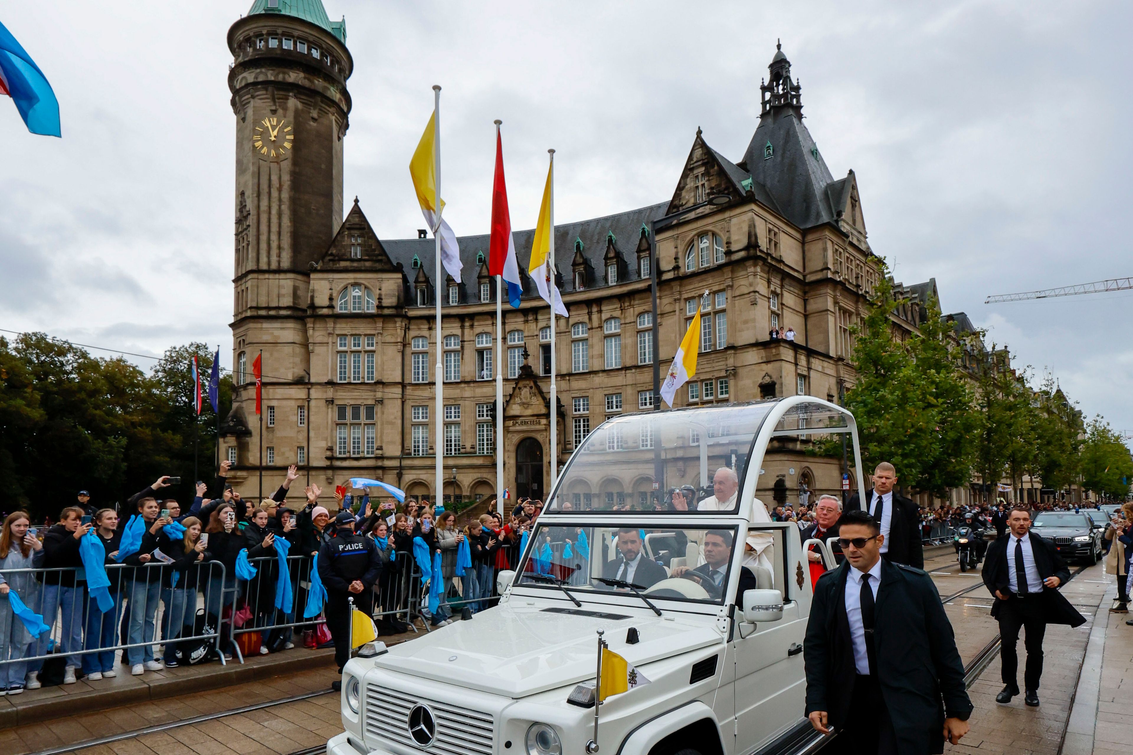 Pope Francis and Archbishop of Luxembourg, Cardinal Jean-Claude Hollerich, right, tour Place de Metz in Luxembourg on the first day of Francis's four-day visit to Luxembourg and Belgium, Thursday, Sept. 26, 2024. (AP Photo/Geert Vanden Wijngaert)